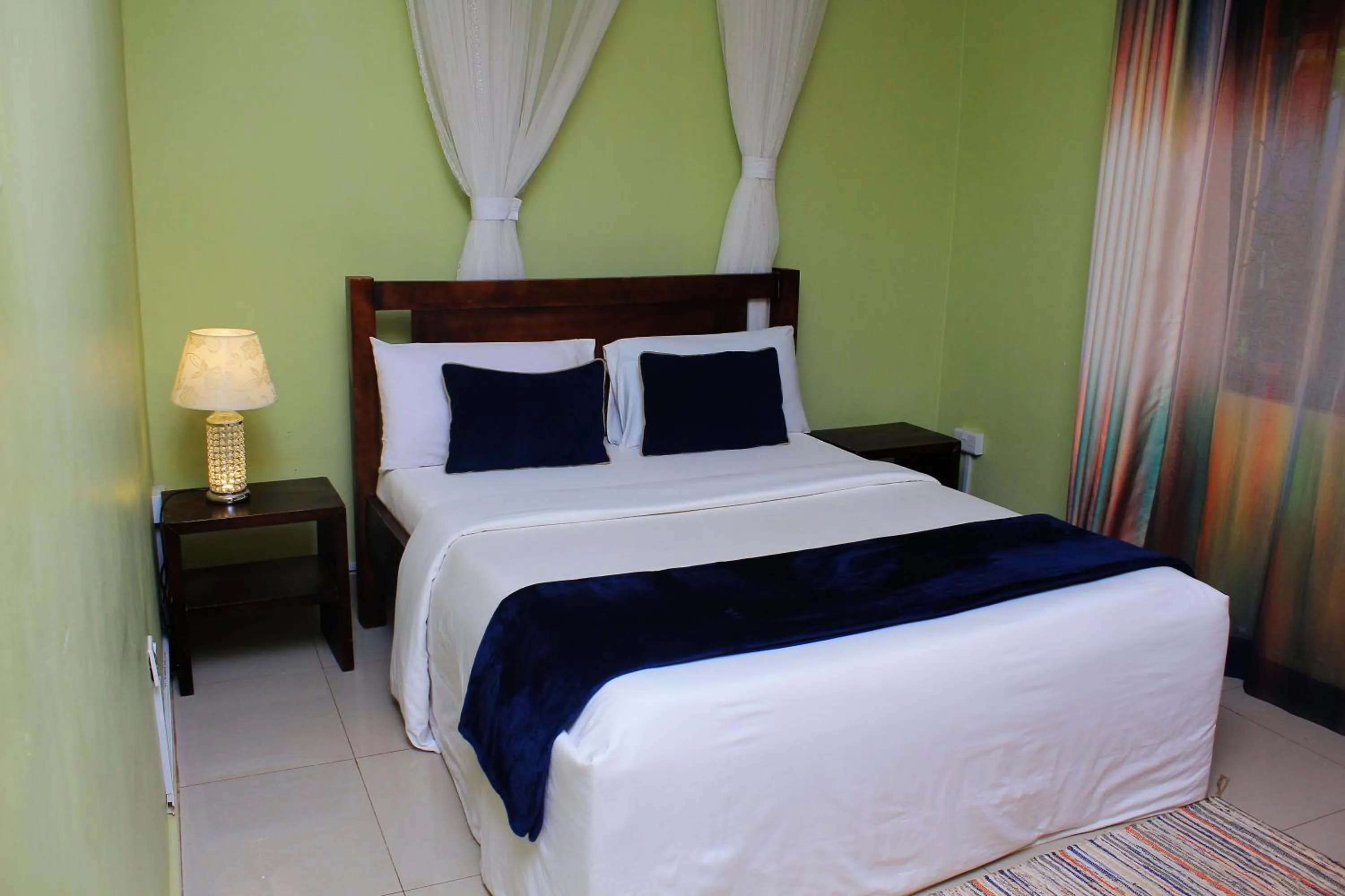 Bed in MAMIKKI Hotel Apartments