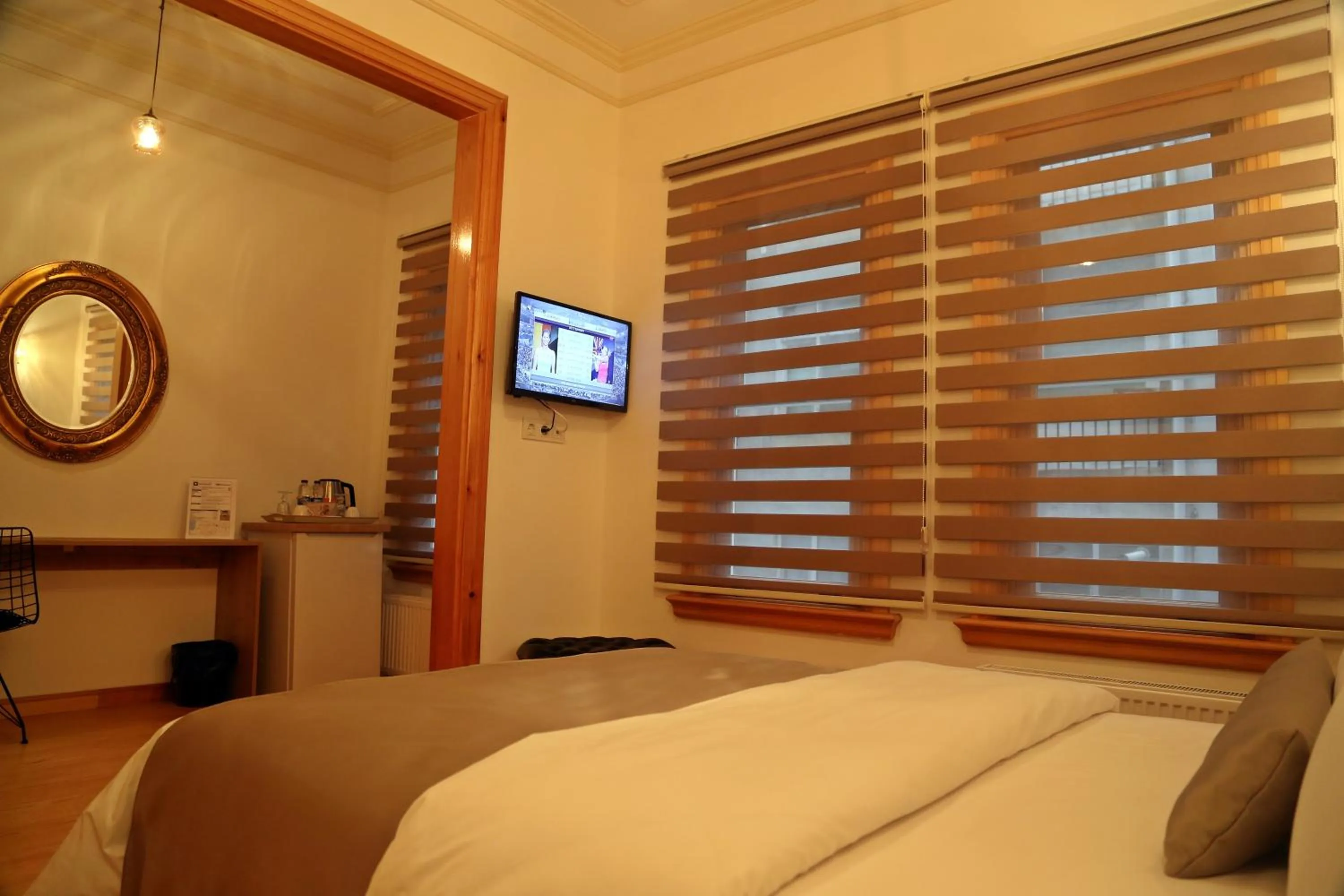 TV and multimedia, Bed in Belizia Hotel