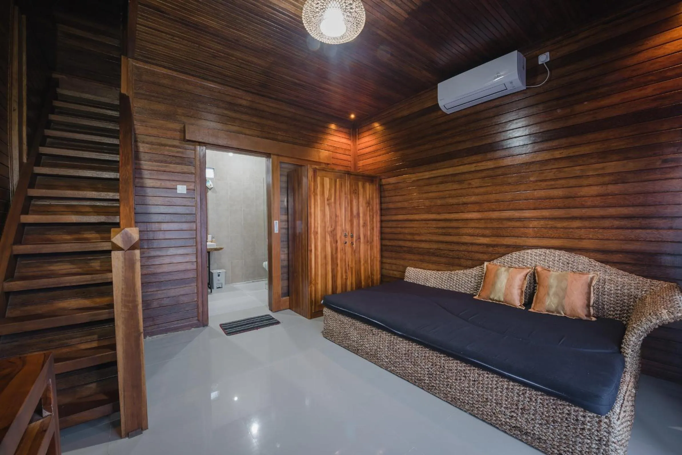 Living room, Bed in Daphila Cottage