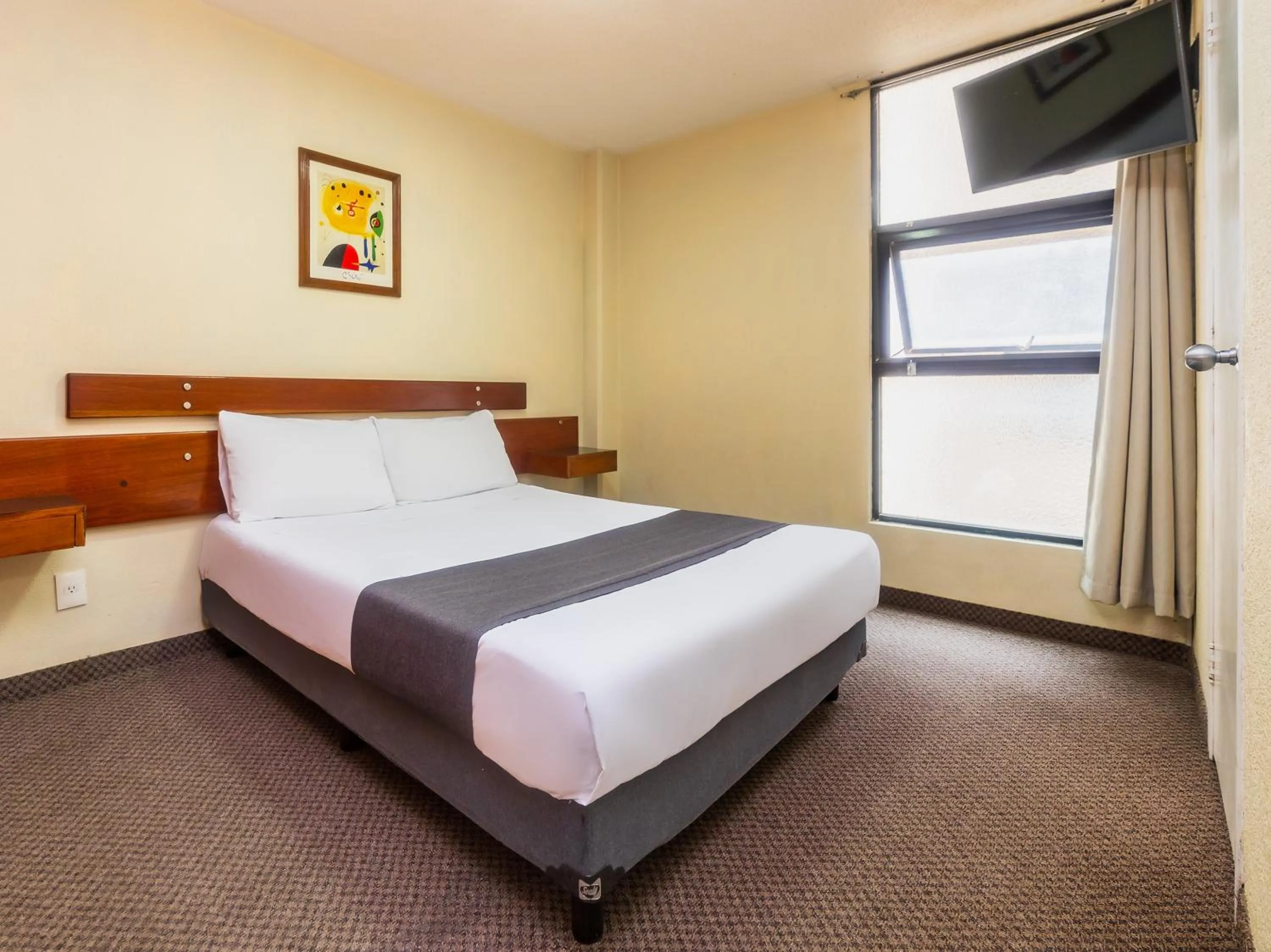 Bedroom, Bed in Capital O Hotel Suites Marne, Mexico City