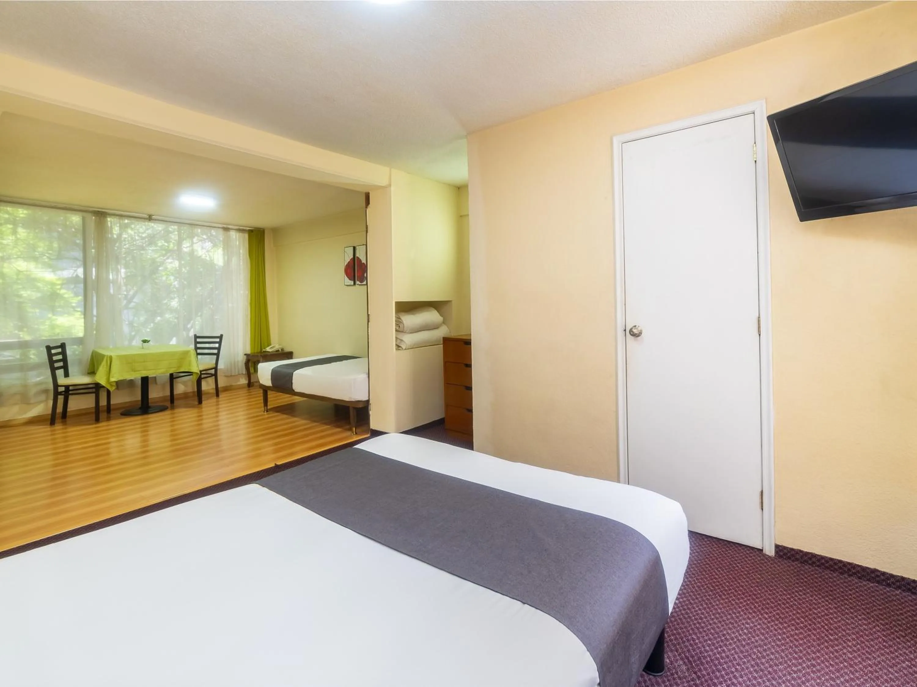 Bedroom, Bed in Capital O Hotel Suites Marne, Mexico City