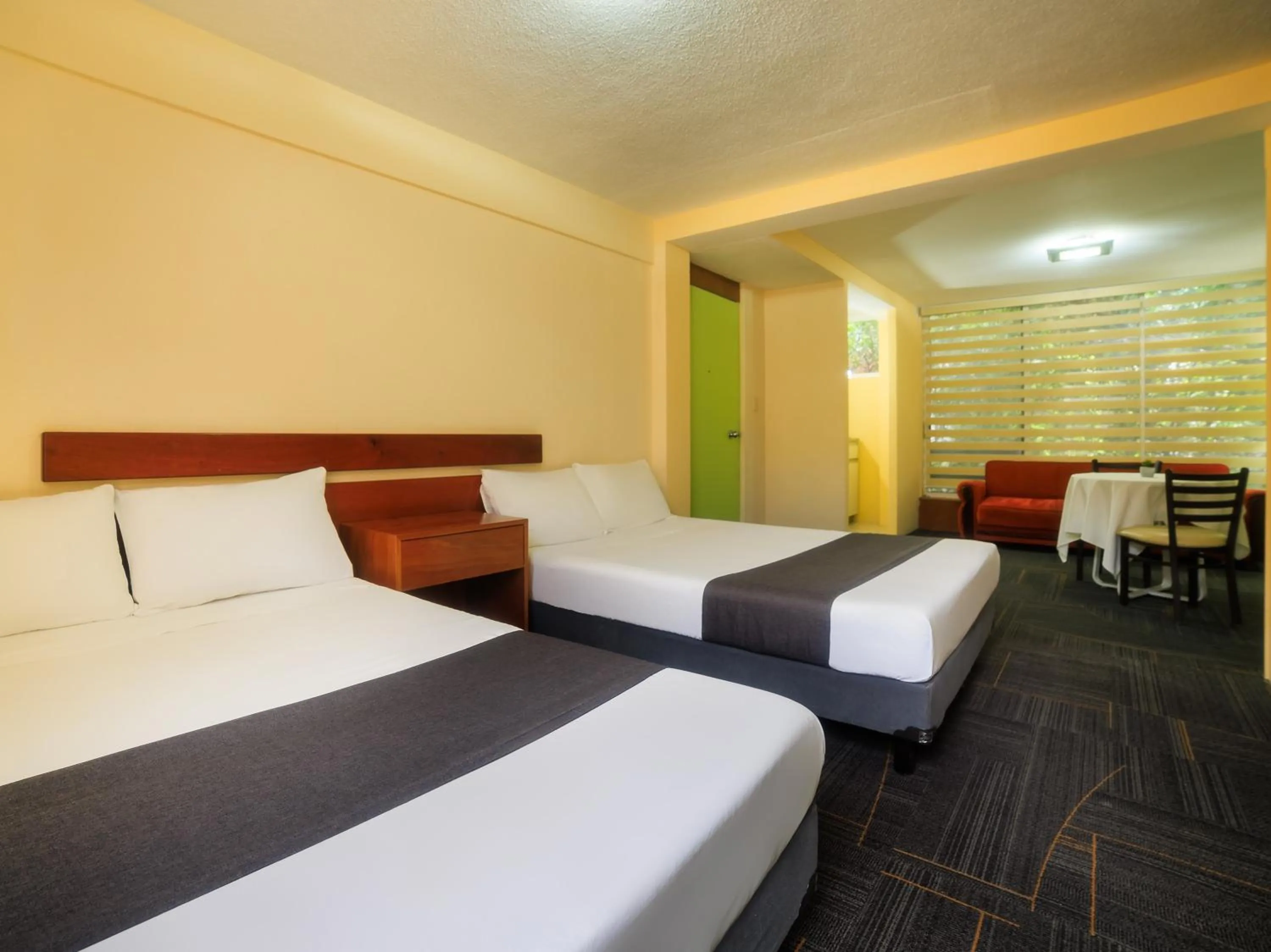 Bedroom, Bed in Capital O Hotel Suites Marne, Mexico City