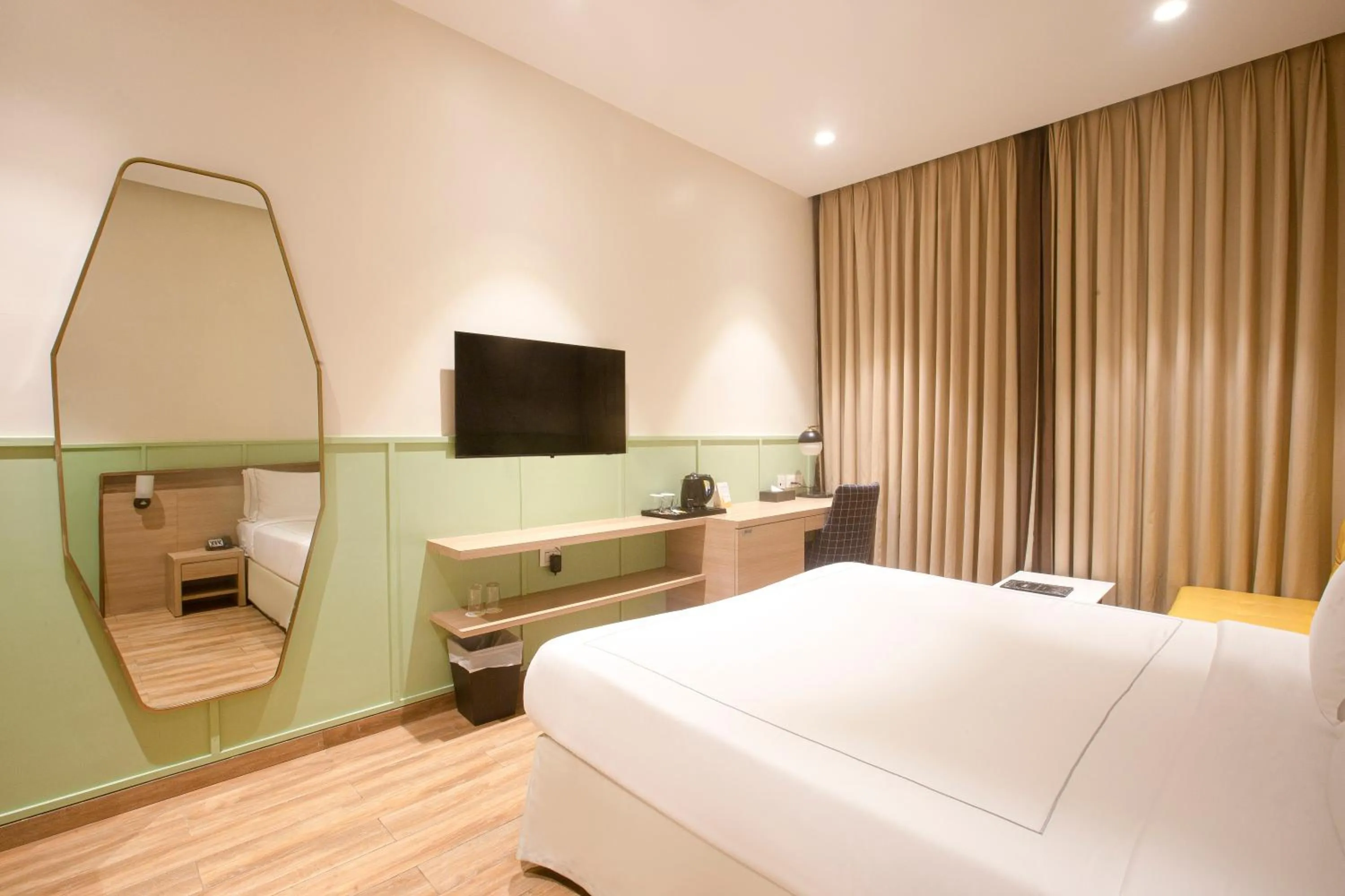 Bed in Hotel Bawa Regency