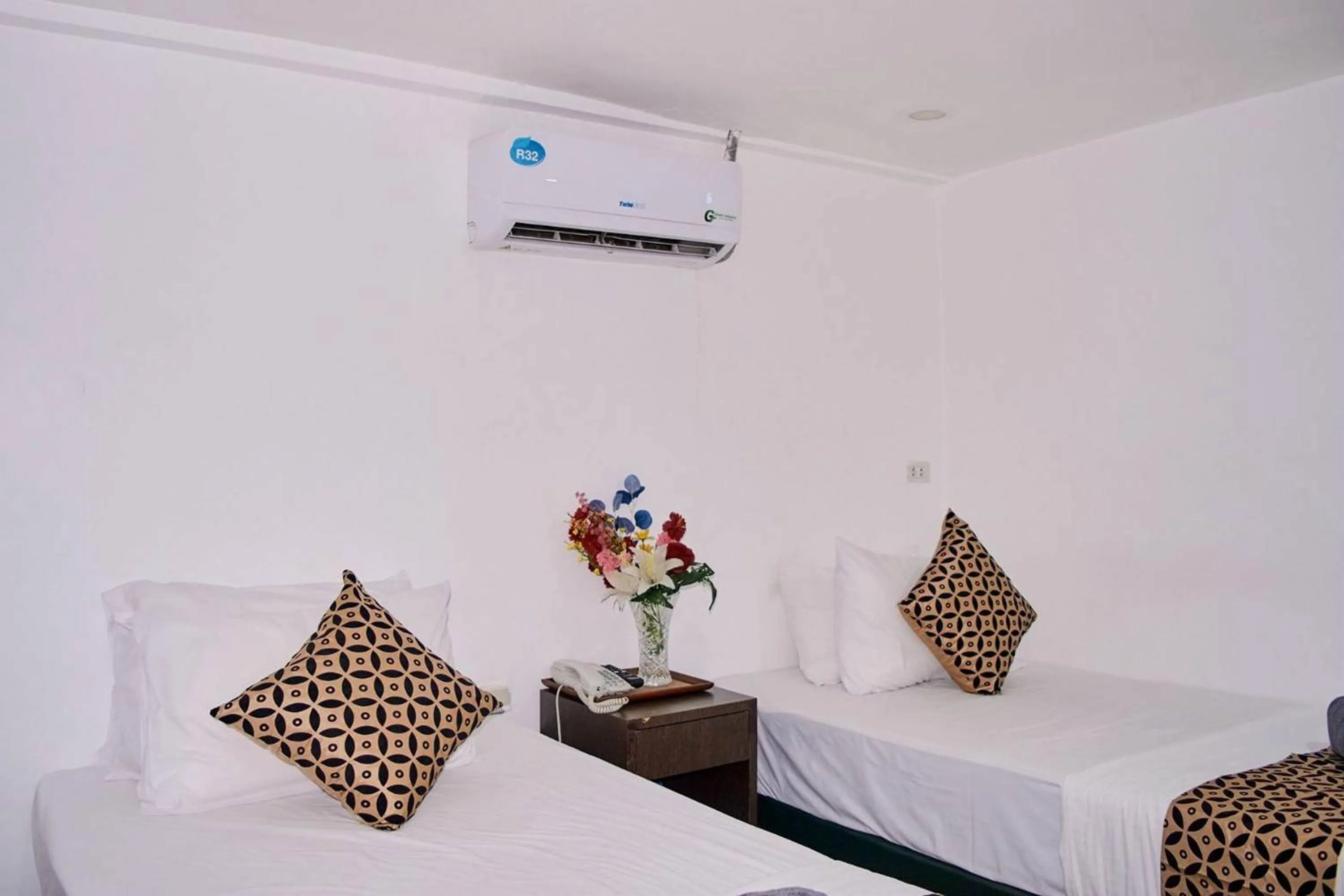 Bed in Papa Ji Hotel and Restaurant