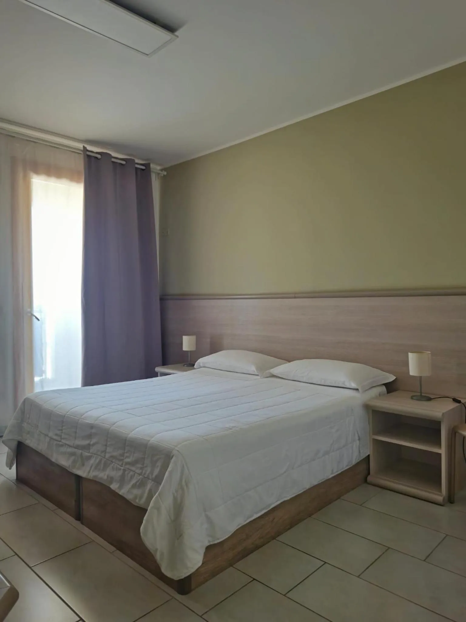 Bed in Mansio Residence & Hotel