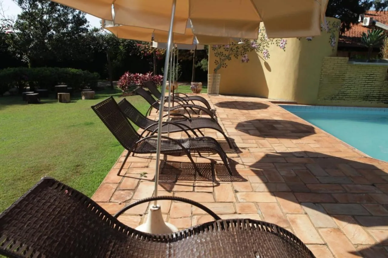 Swimming pool in Hotel Pousada Chalé das Flores