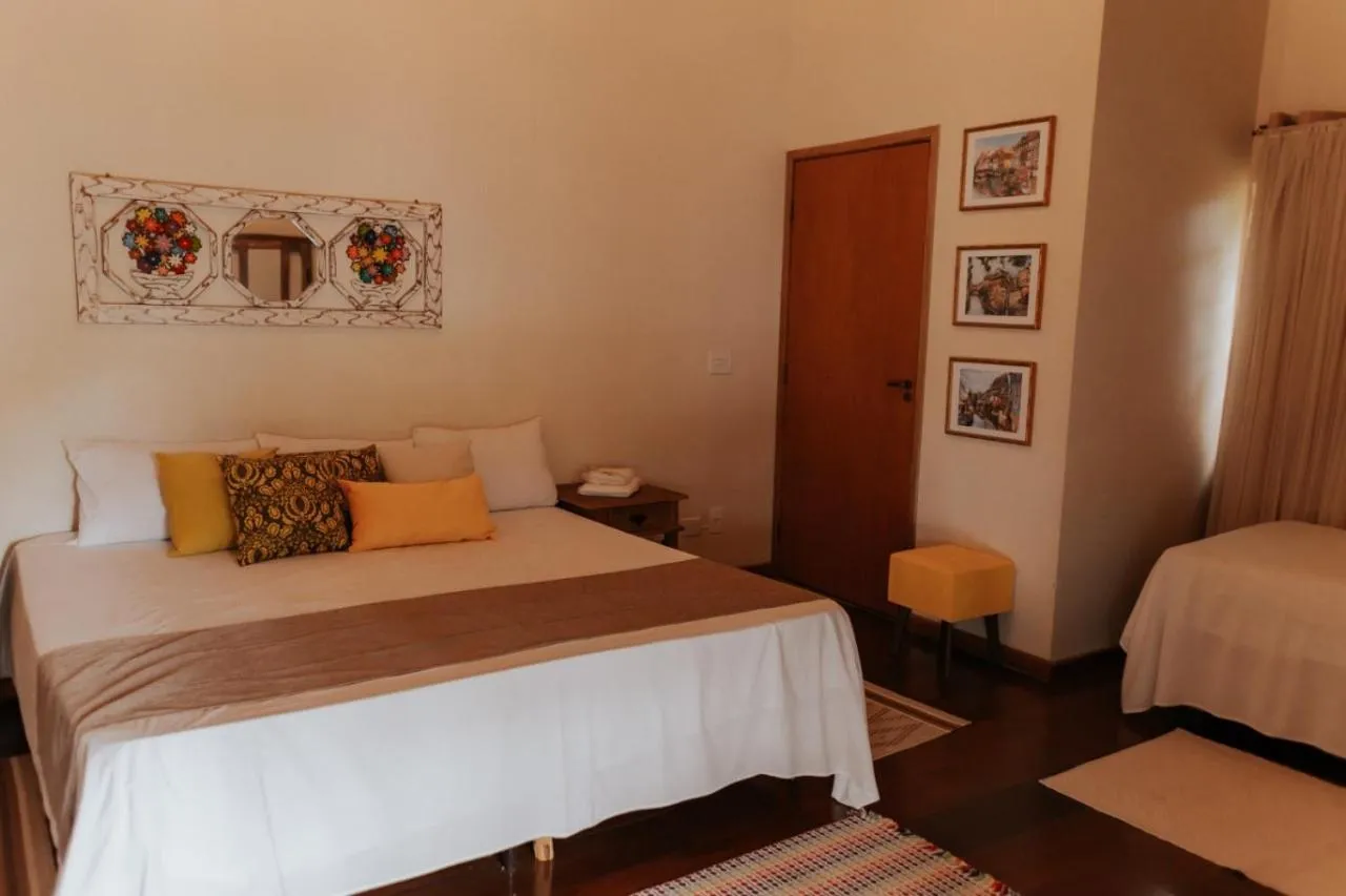 Bed in Hotel Pousada Chalé das Flores