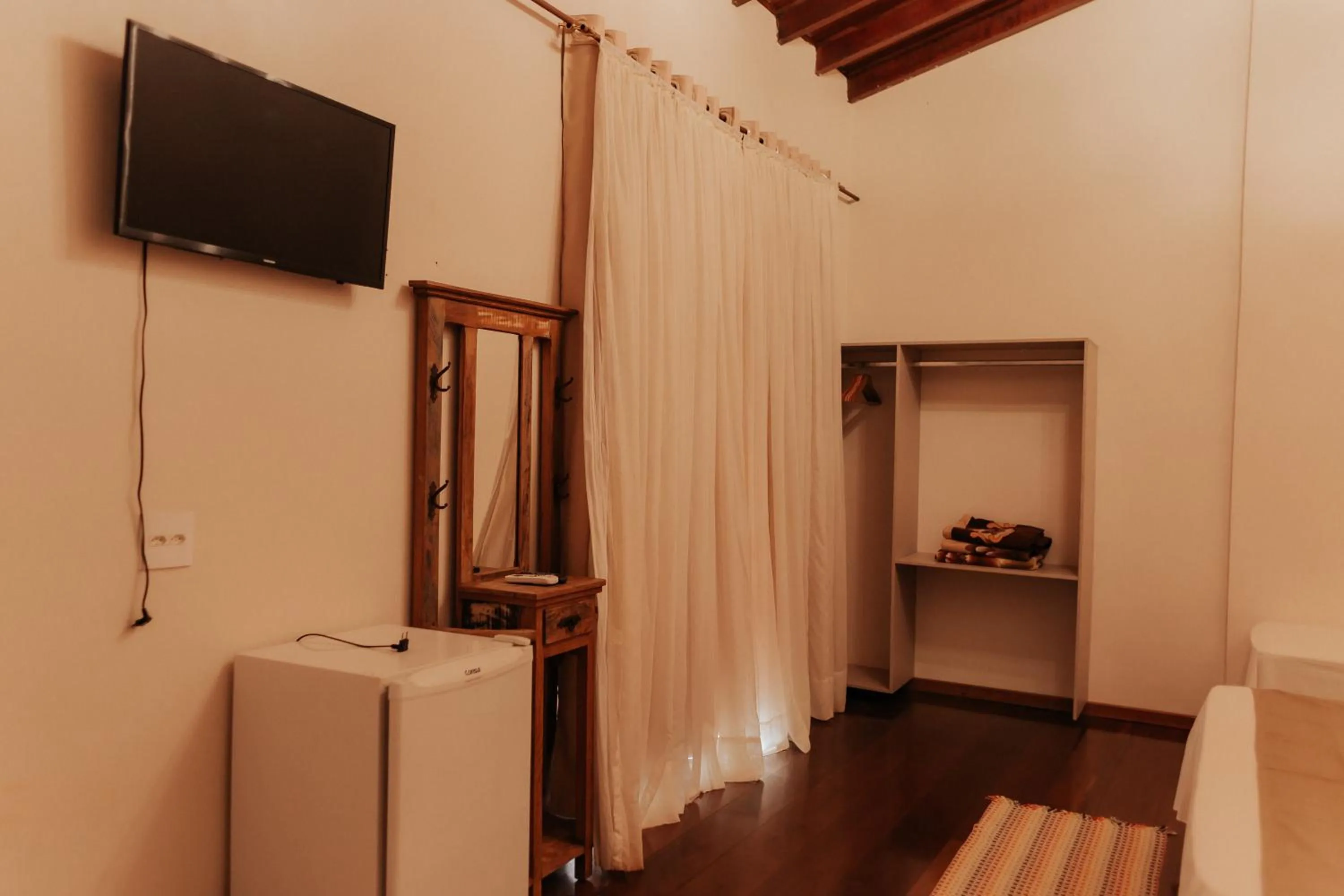 TV and multimedia in Hotel Pousada Chalé das Flores