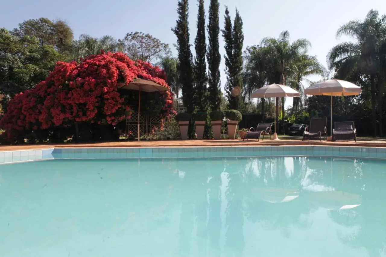 Swimming pool in Hotel Pousada Chalé das Flores