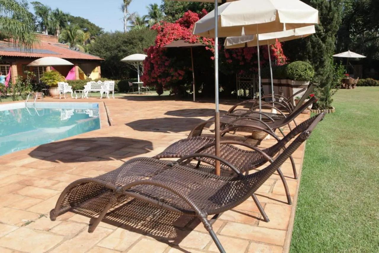 Swimming pool in Hotel Pousada Chalé das Flores
