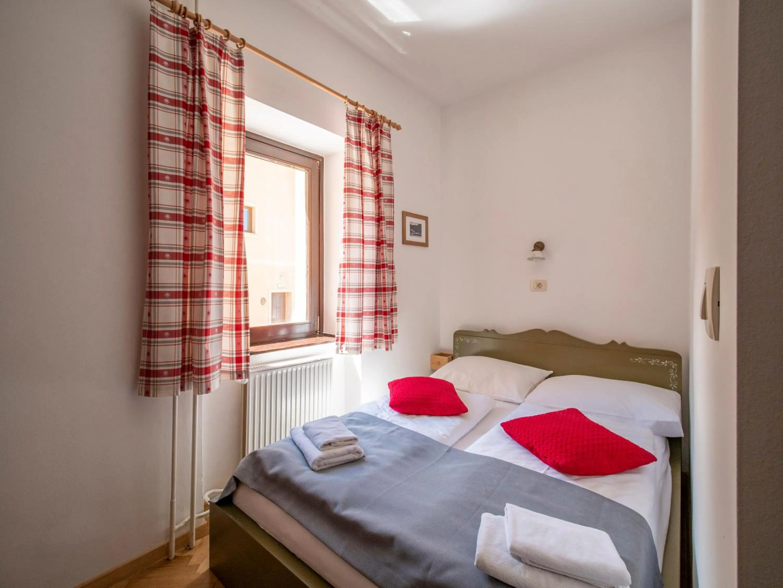 Bed in Berghi Hotel and Apartments