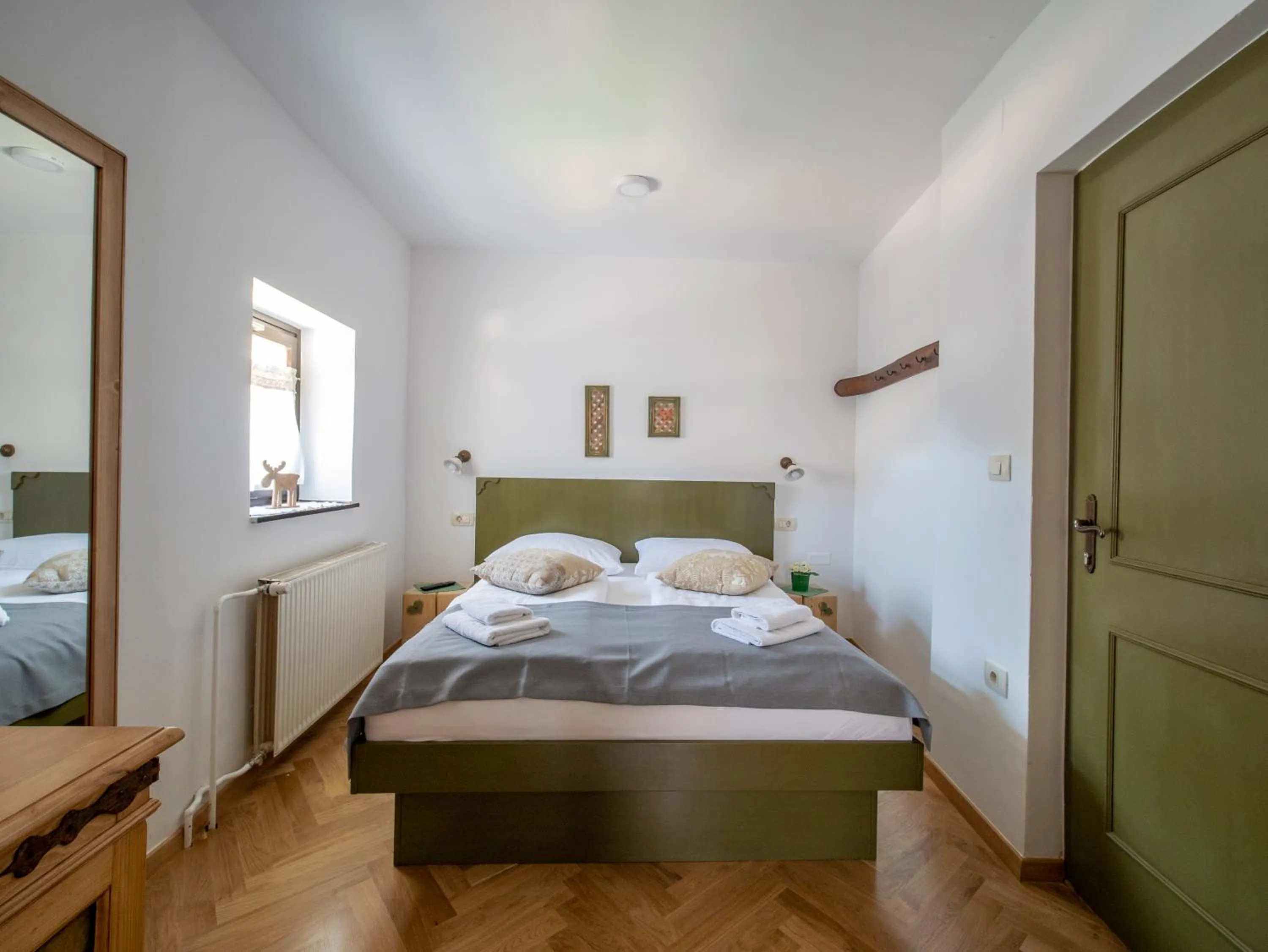 Bed in Berghi Hotel and Apartments