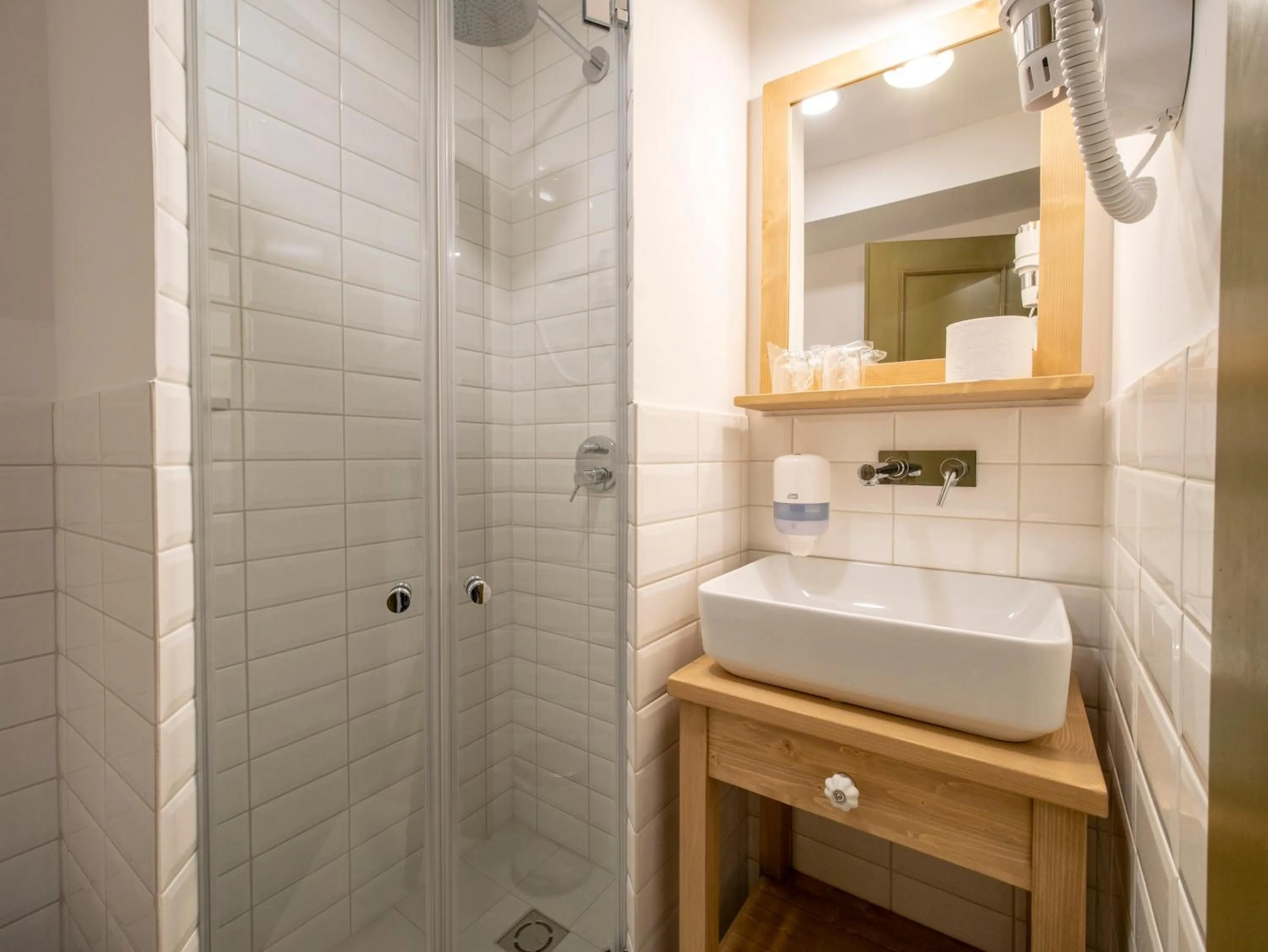 Bathroom in Berghi Hotel and Apartments