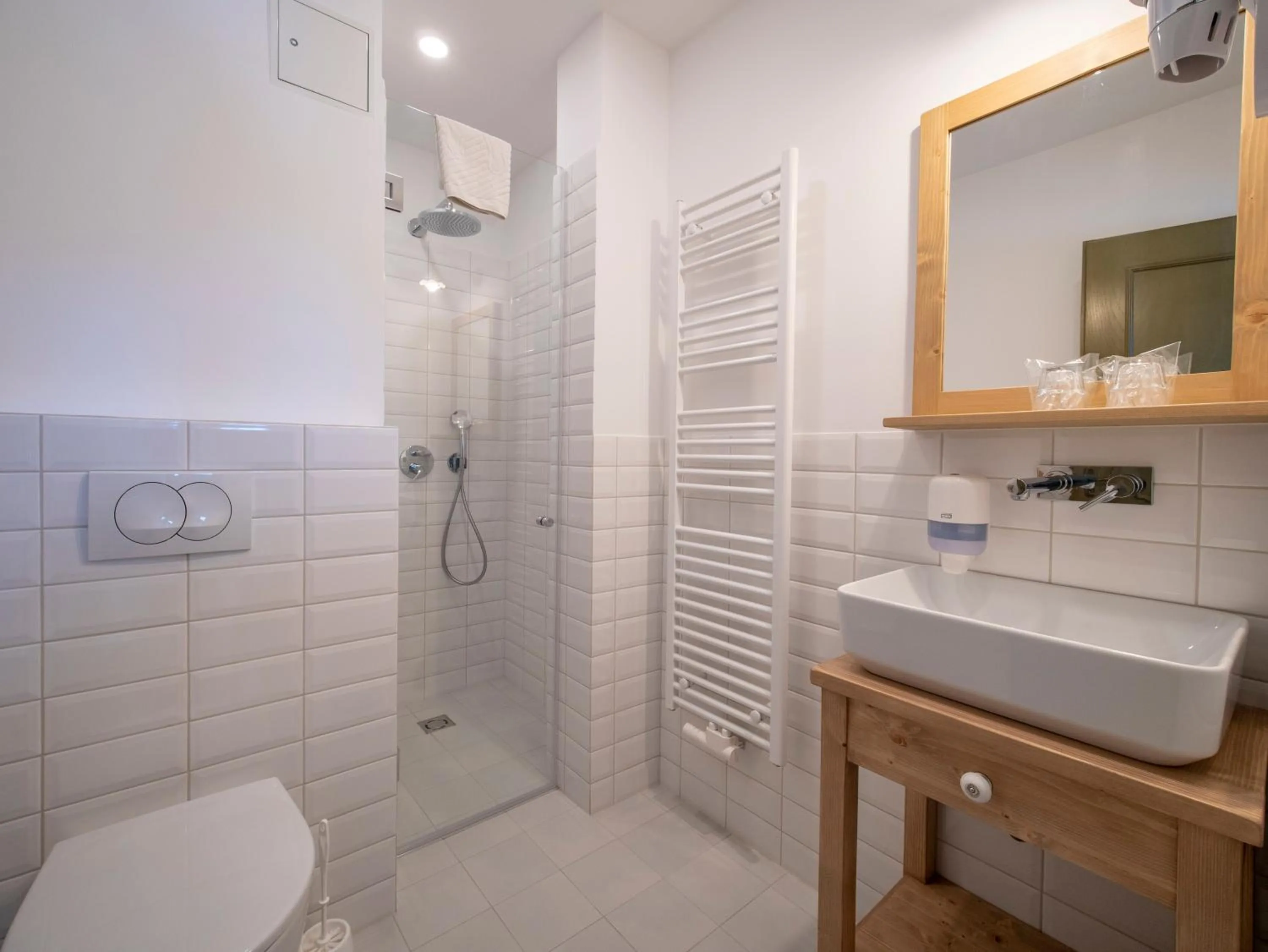 Bathroom in Berghi Hotel and Apartments