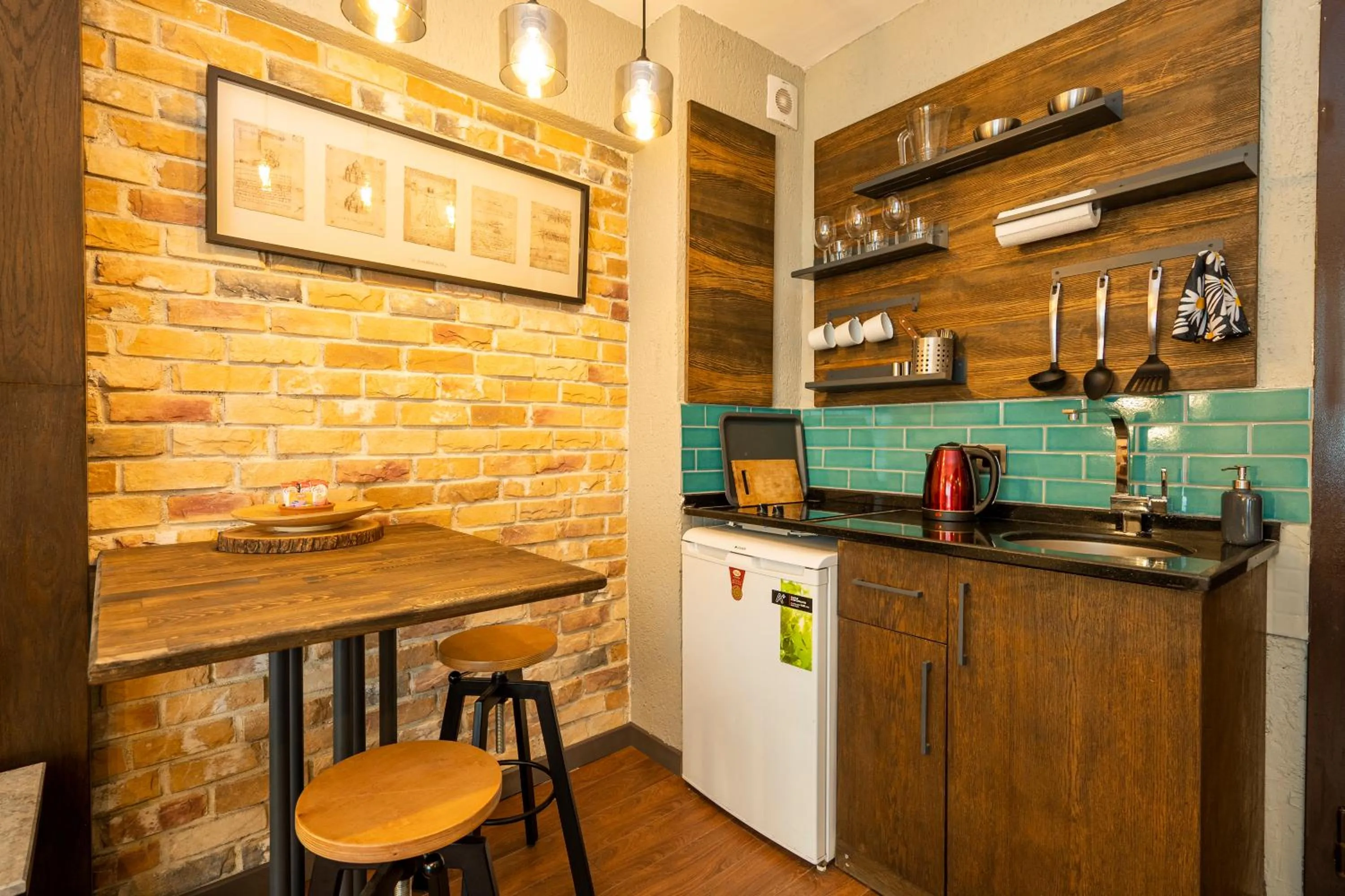 Kitchen or kitchenette in Cube Suites