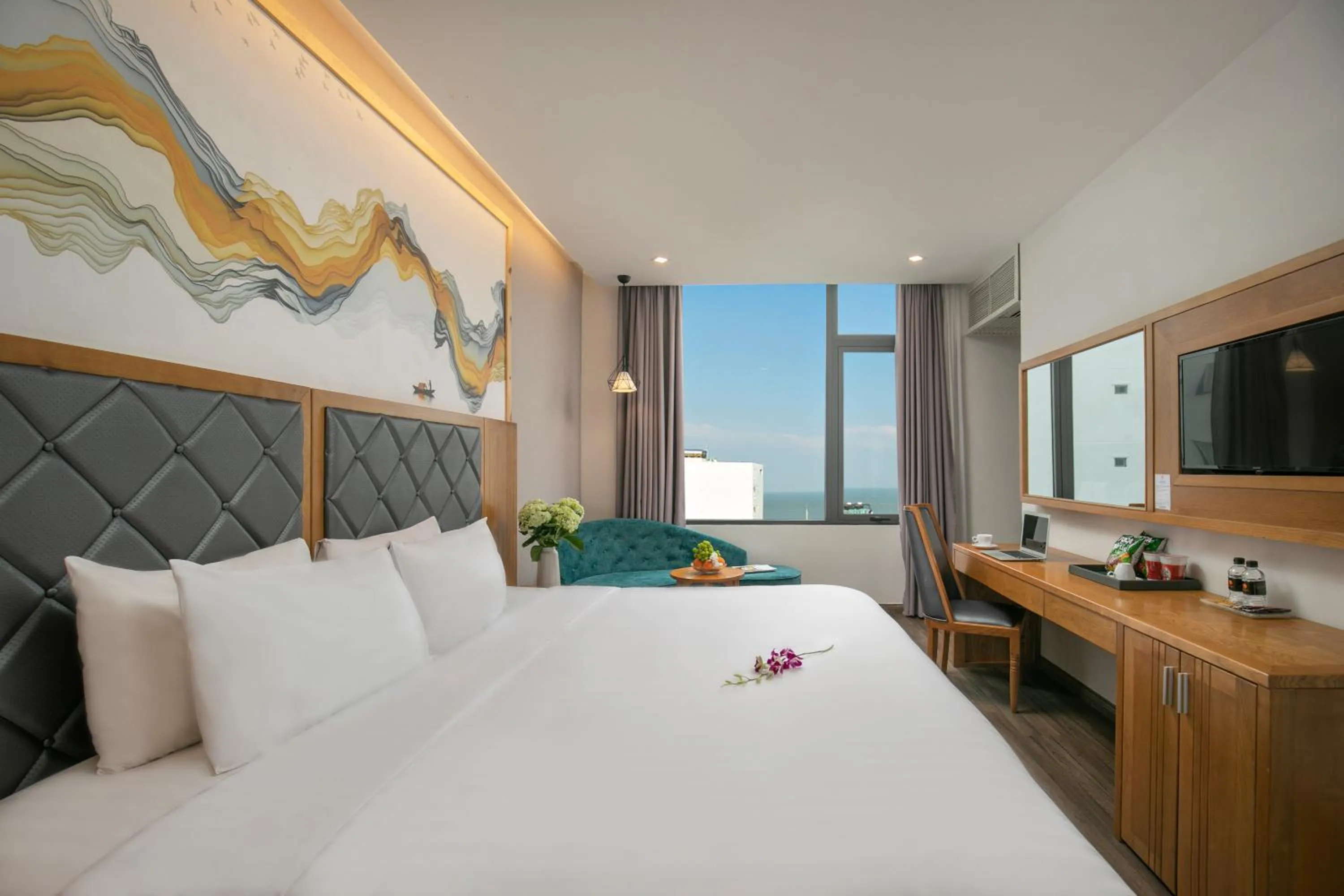 Bed in Grand Sunrise Boutique Hotel