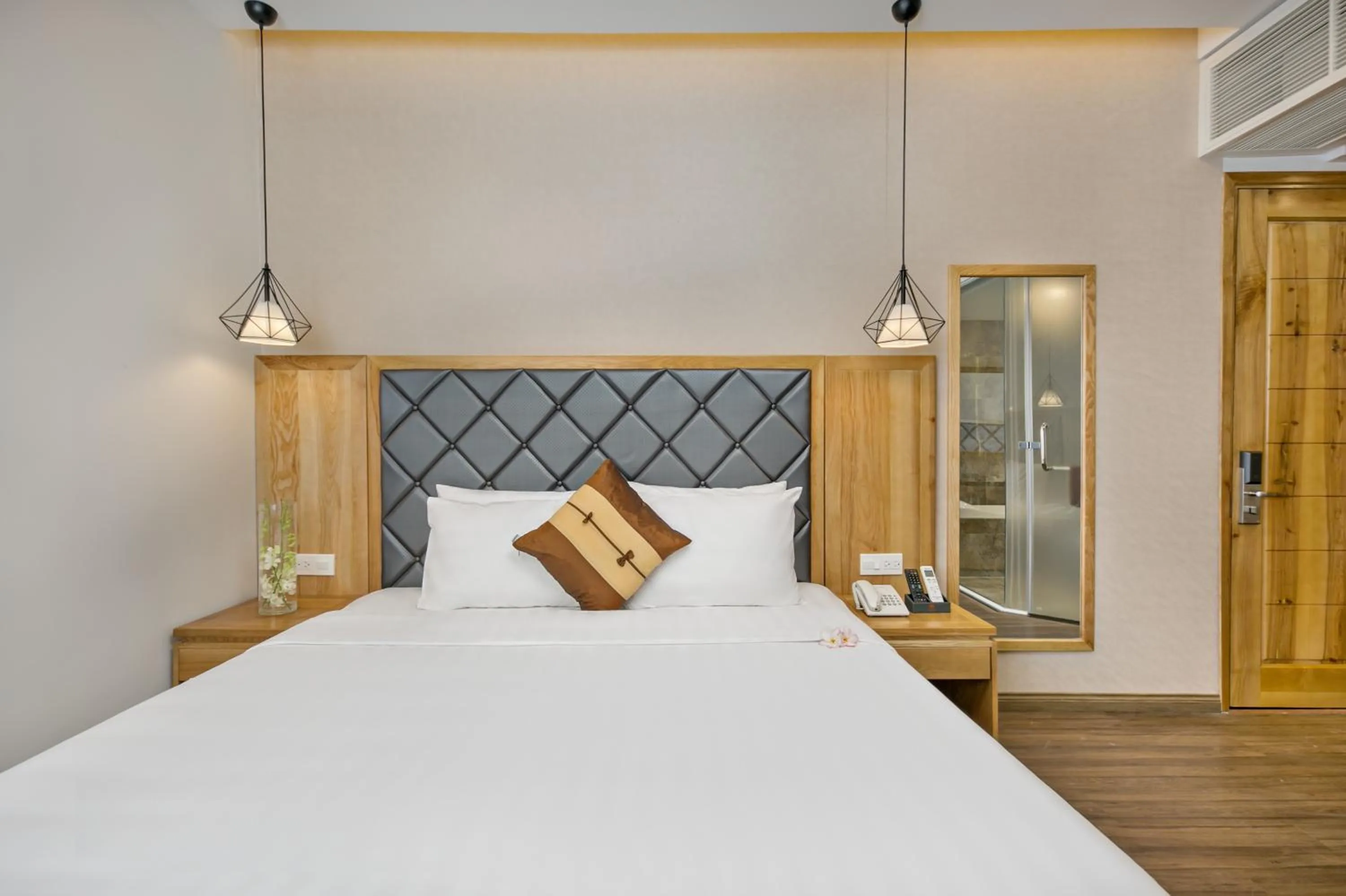 Bed in Grand Sunrise Boutique Hotel