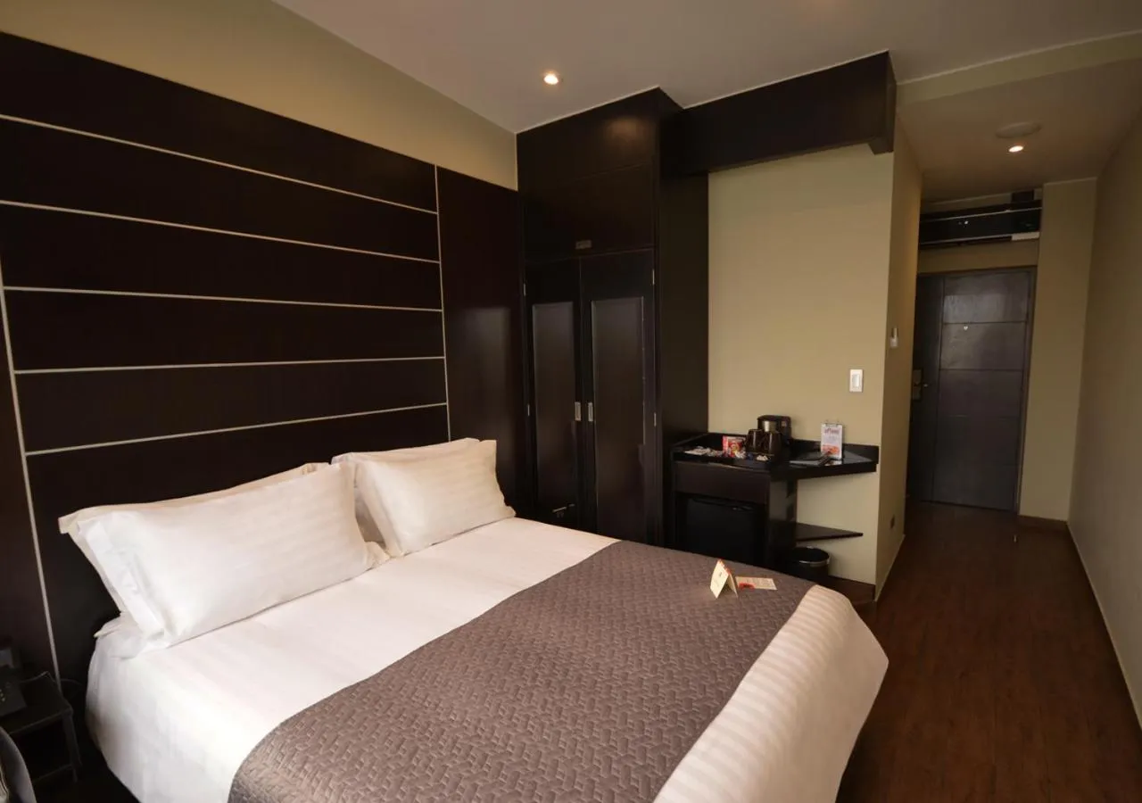 Bedroom, Bed in qp Hotels Lima