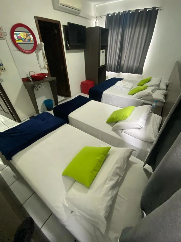 Photo of the whole room, Bed in Rezende Suítes