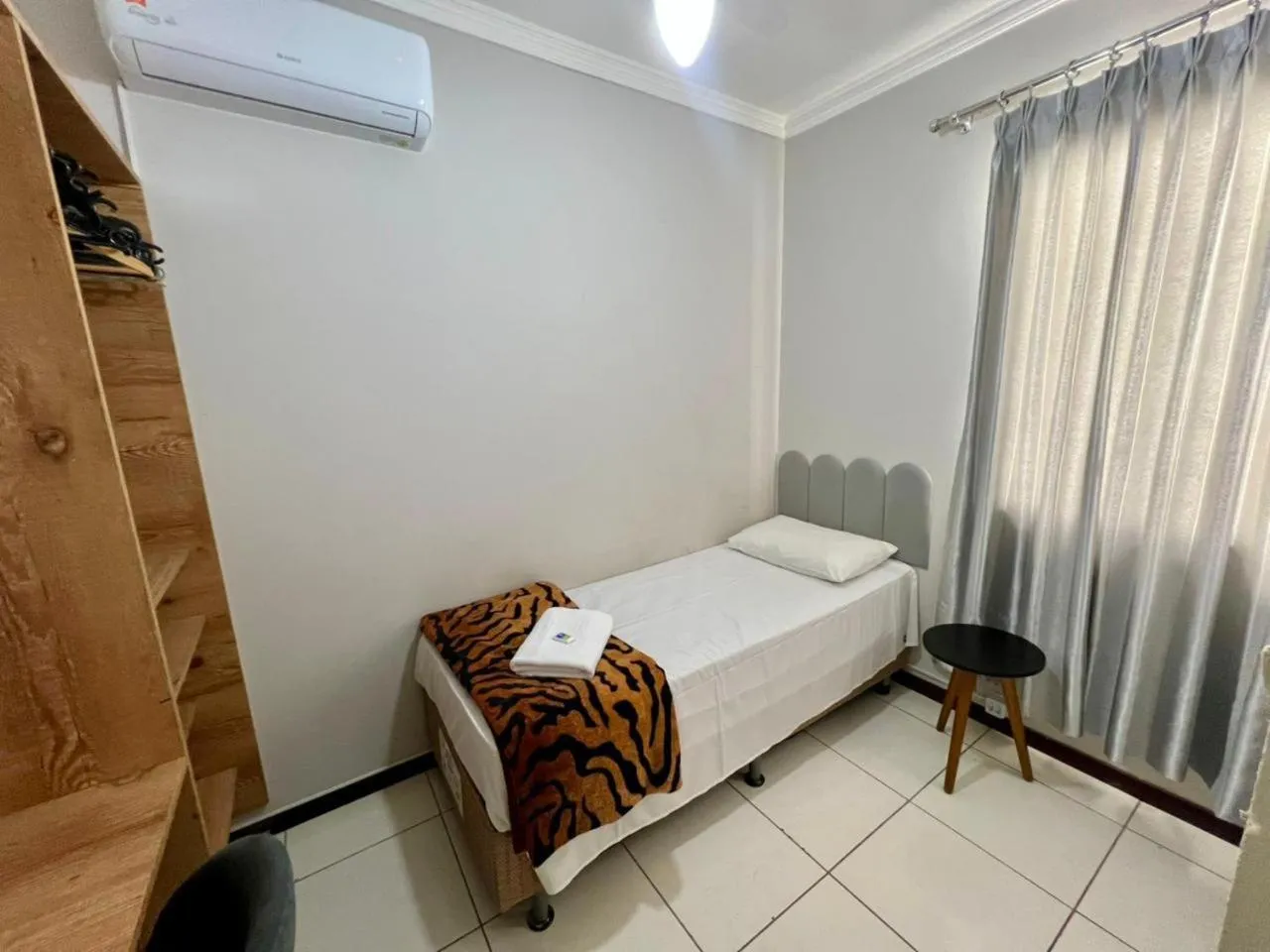 Bed in Rezende Suítes