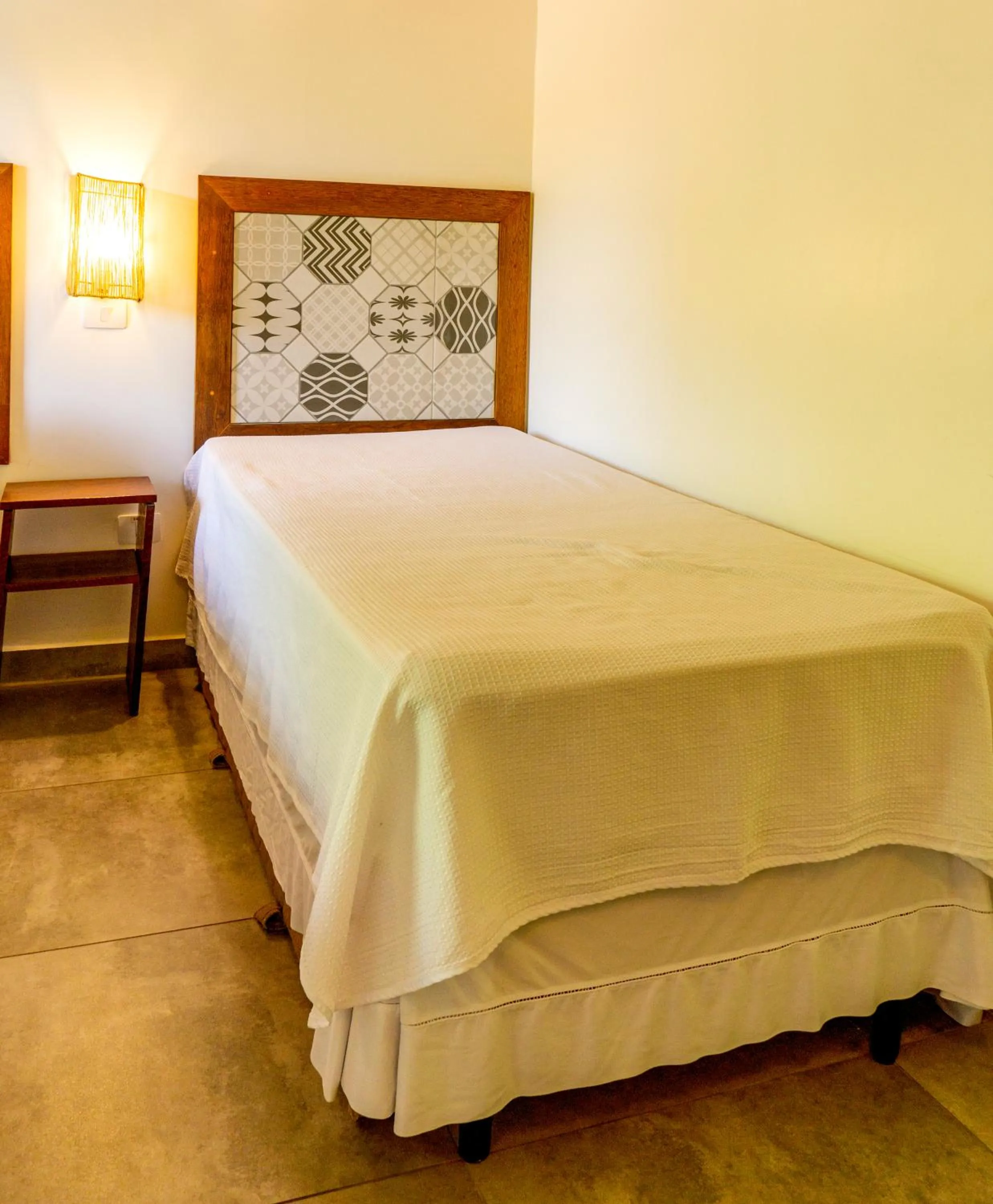 Bed in Pousada Casarão