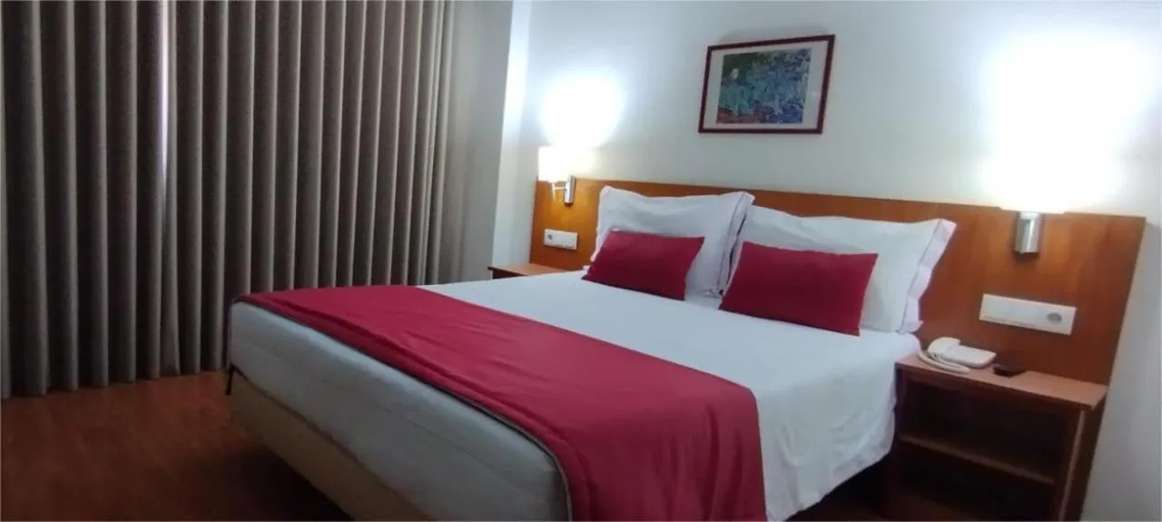 Bed in Hotel Dom Vilas