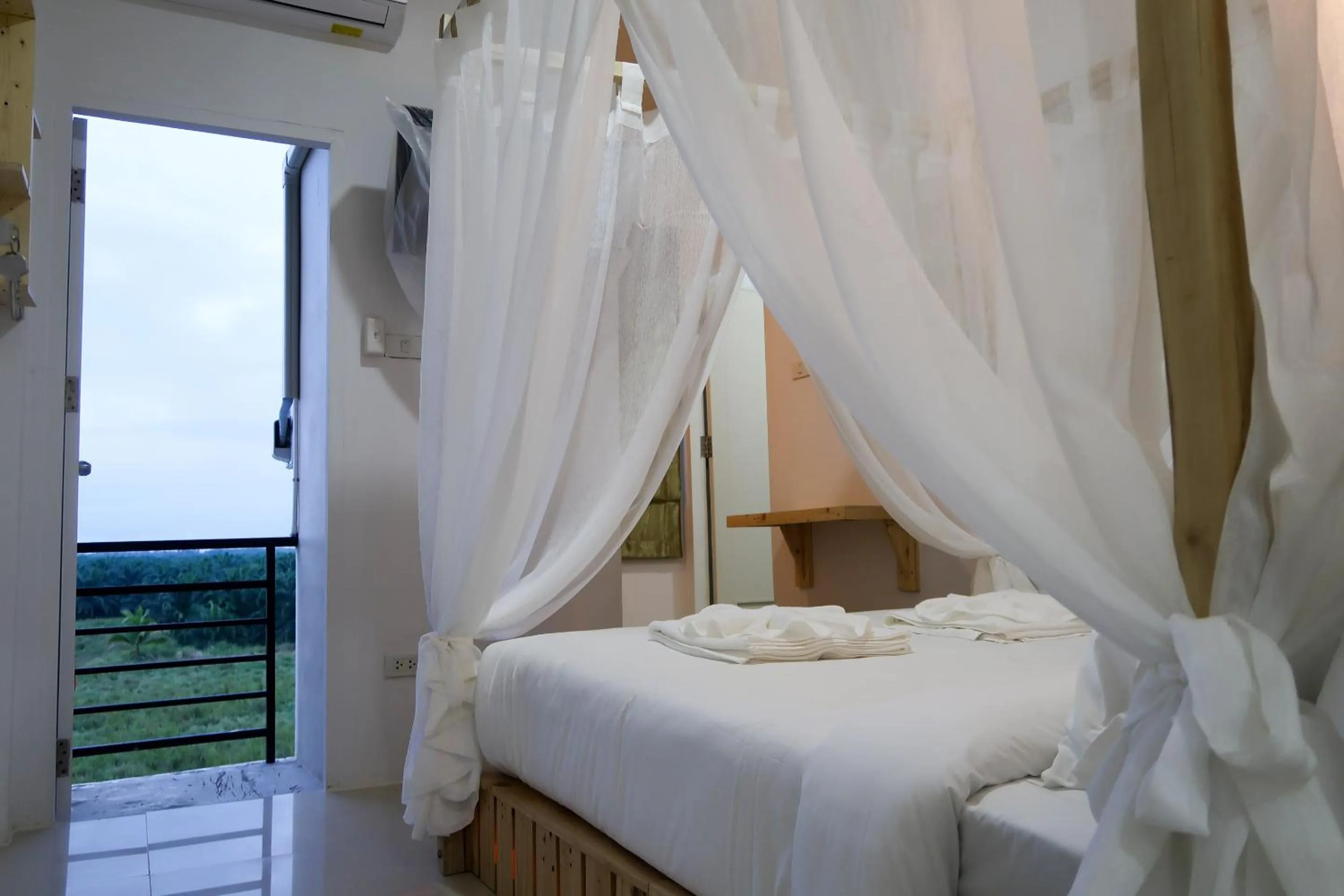 View (from property/room), Bed in Baan URT Suratthani Airport Hotel