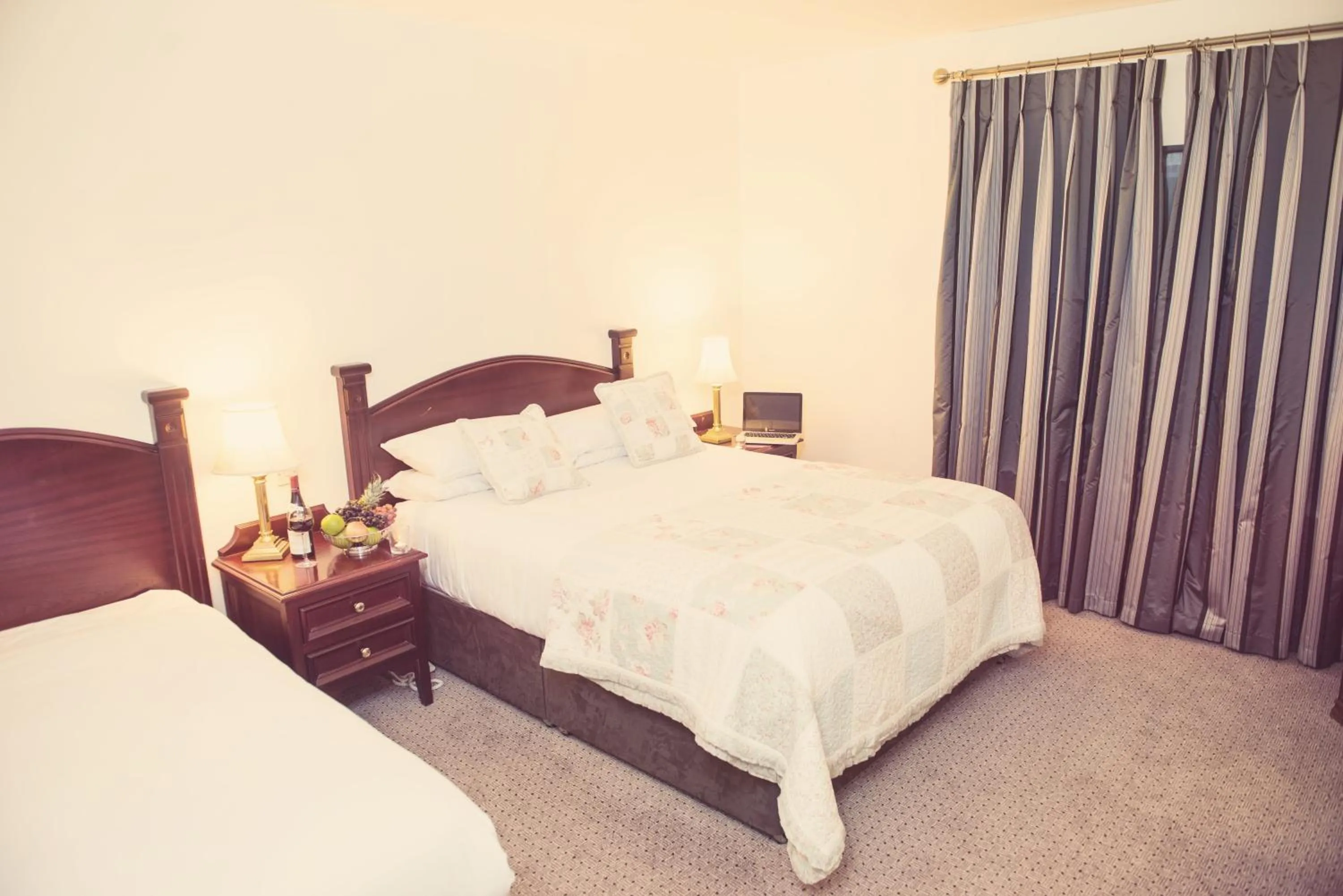 Bed in Devon Inn Hotel