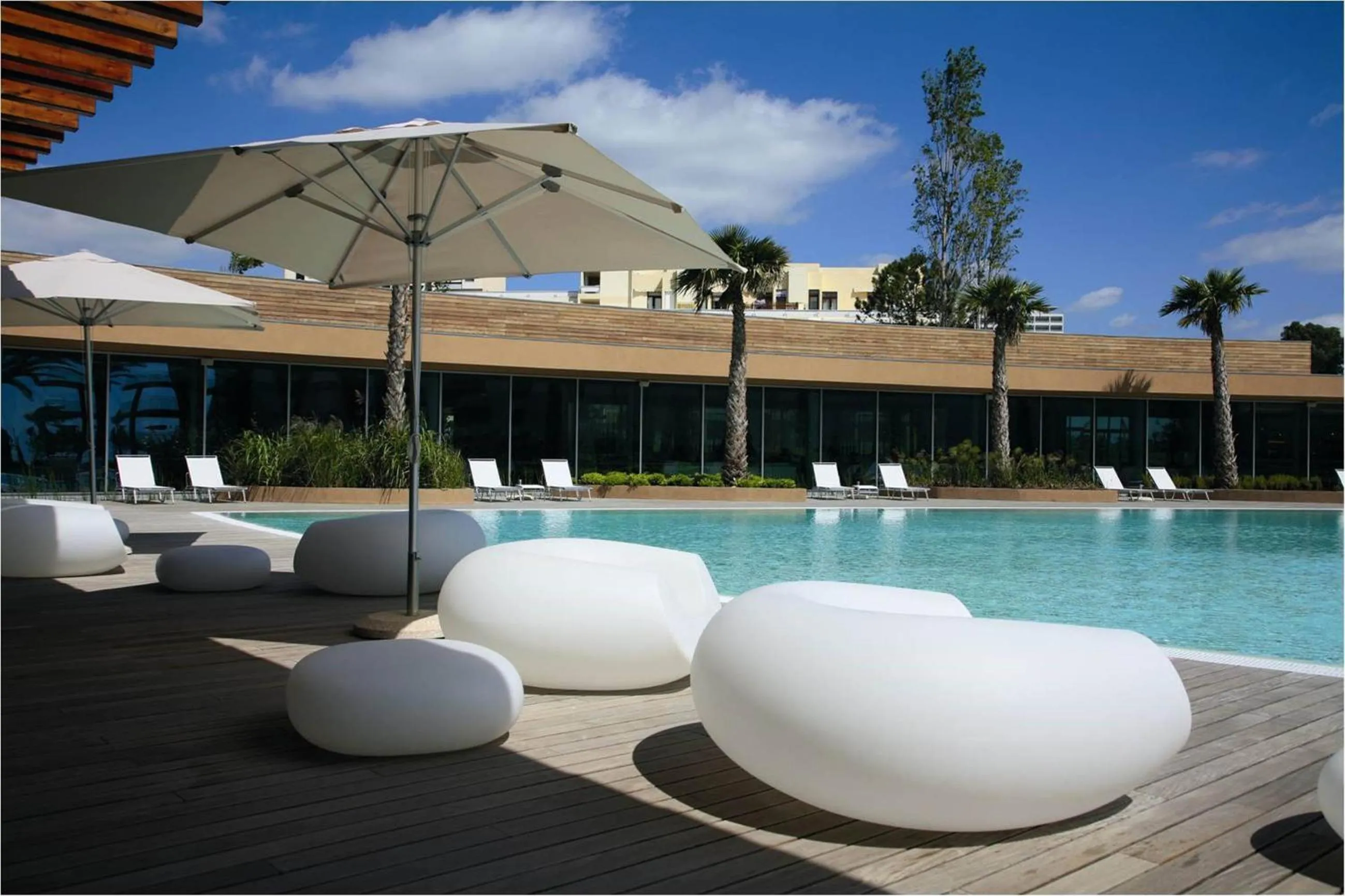 Swimming pool in Aqualuz Troia Rio by The Editory