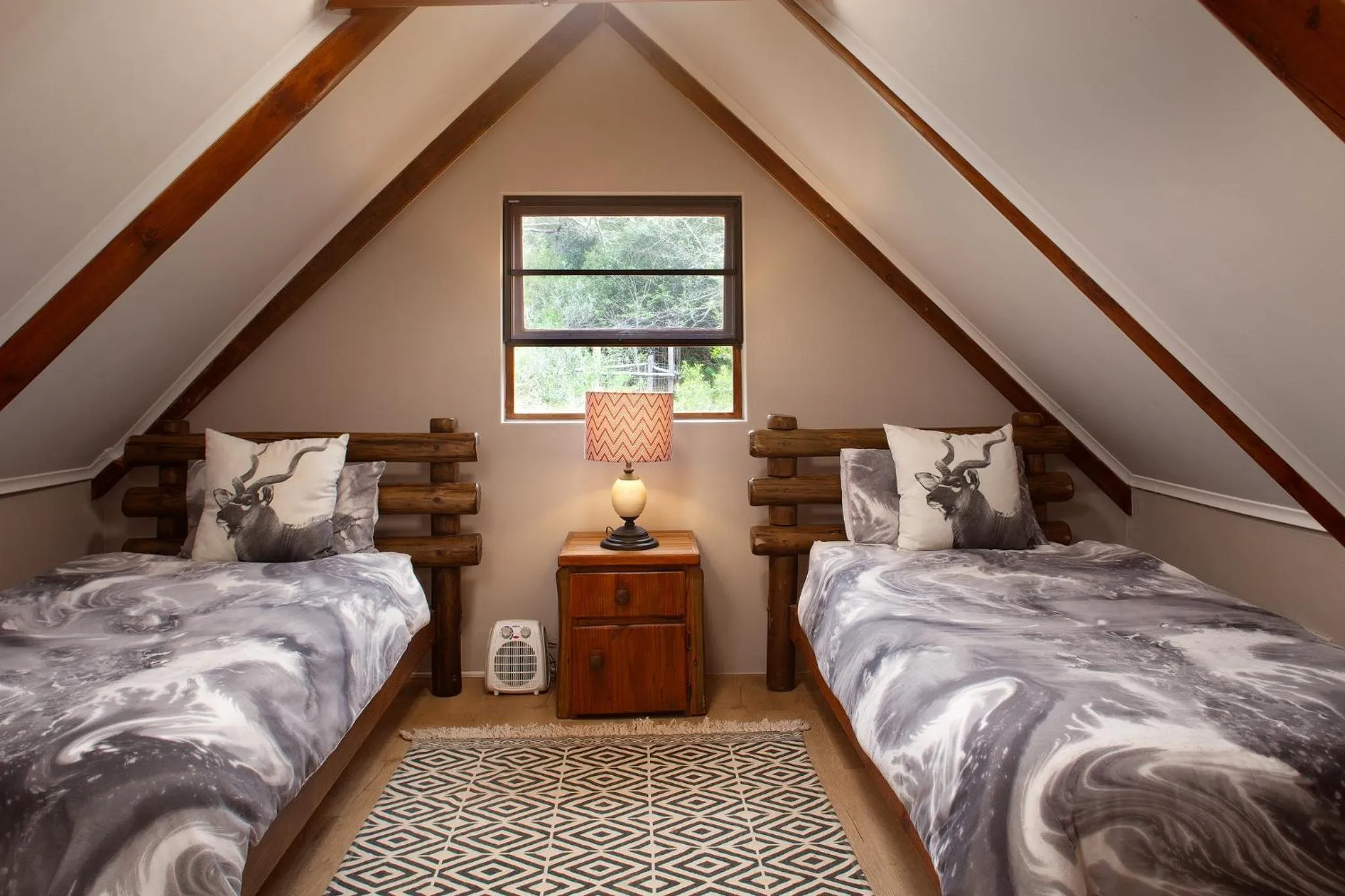 Bed in Garden Route Safari Camp