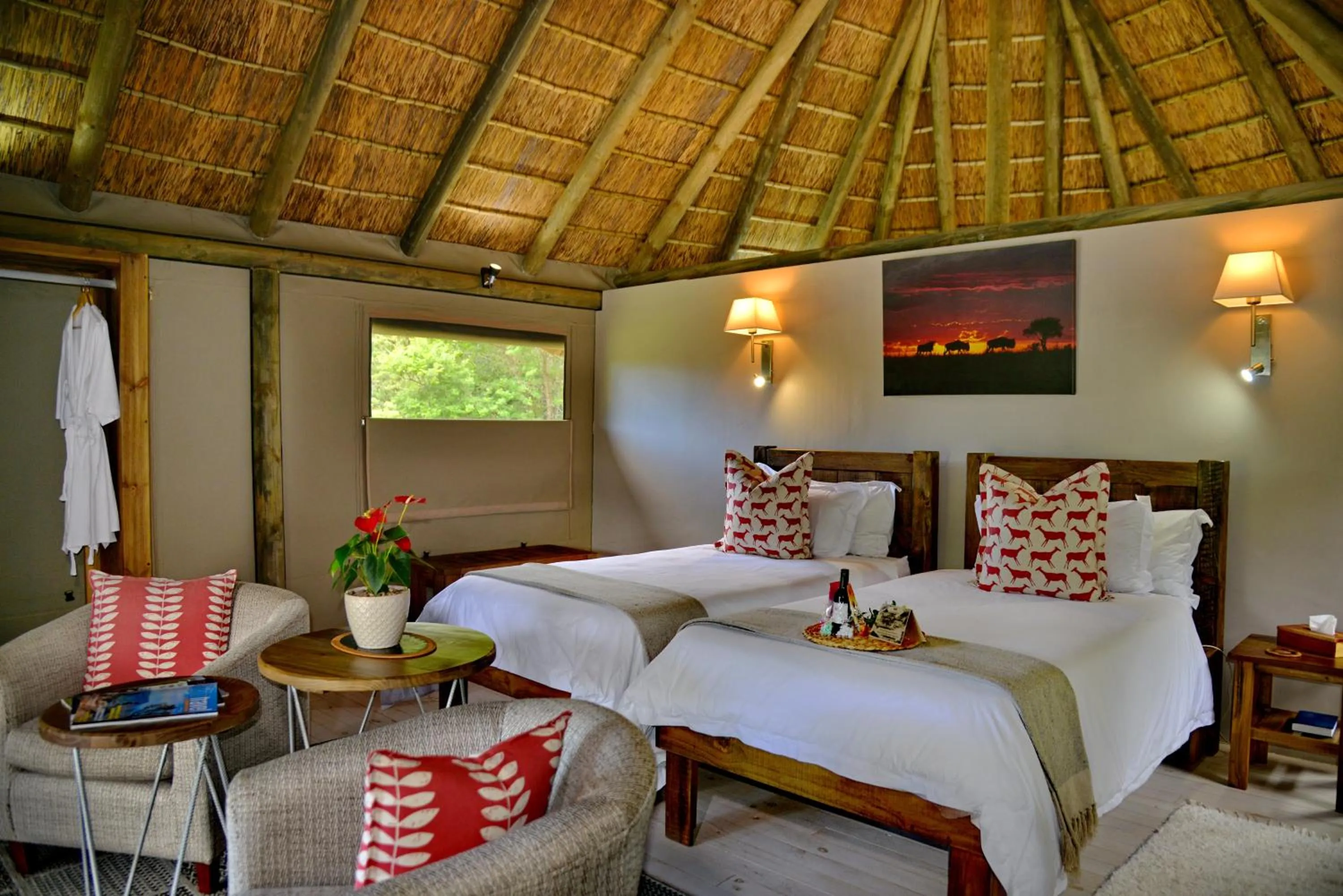 Bed in Garden Route Safari Camp