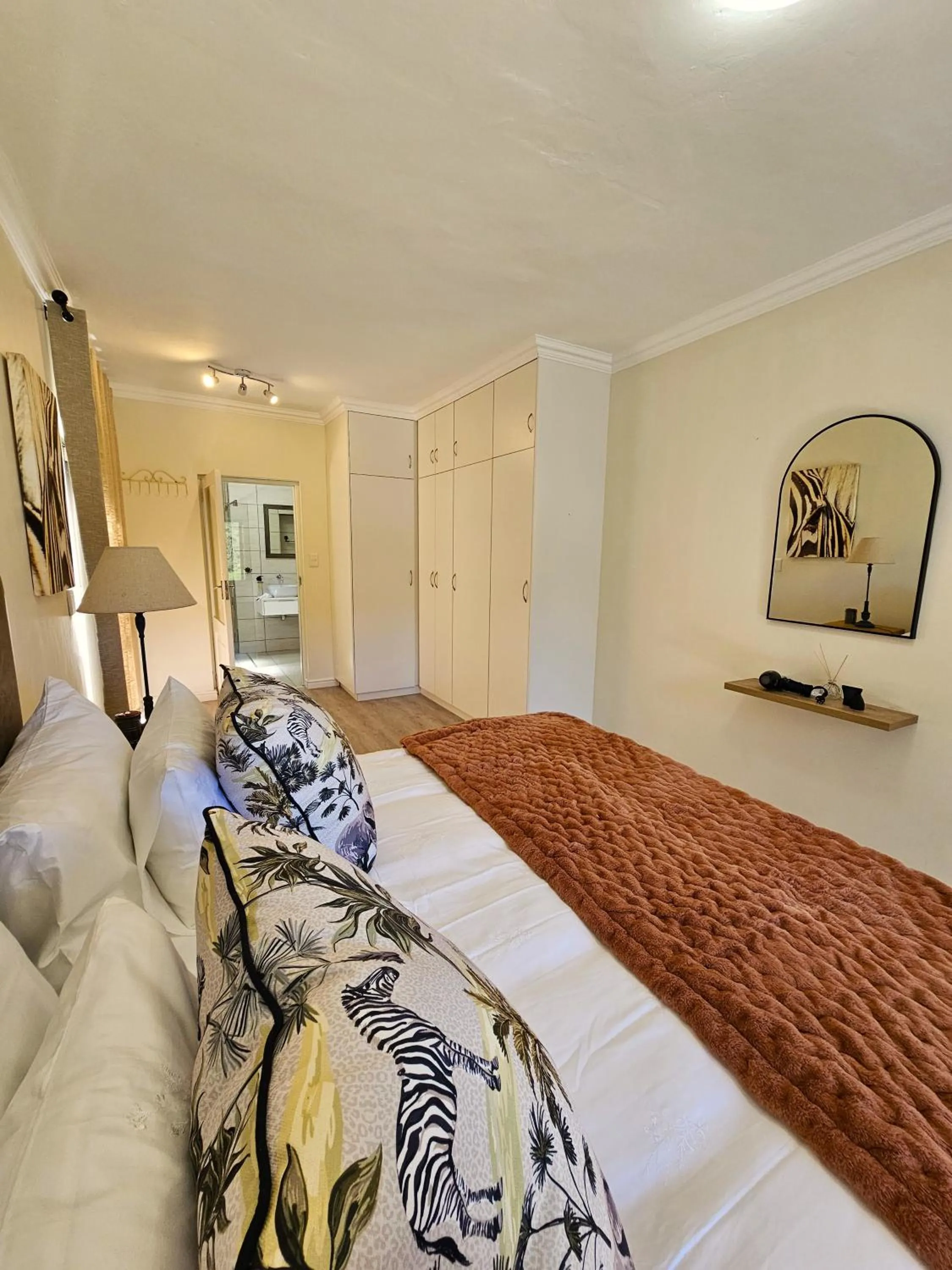 Bed in Garden Route Safari Camp