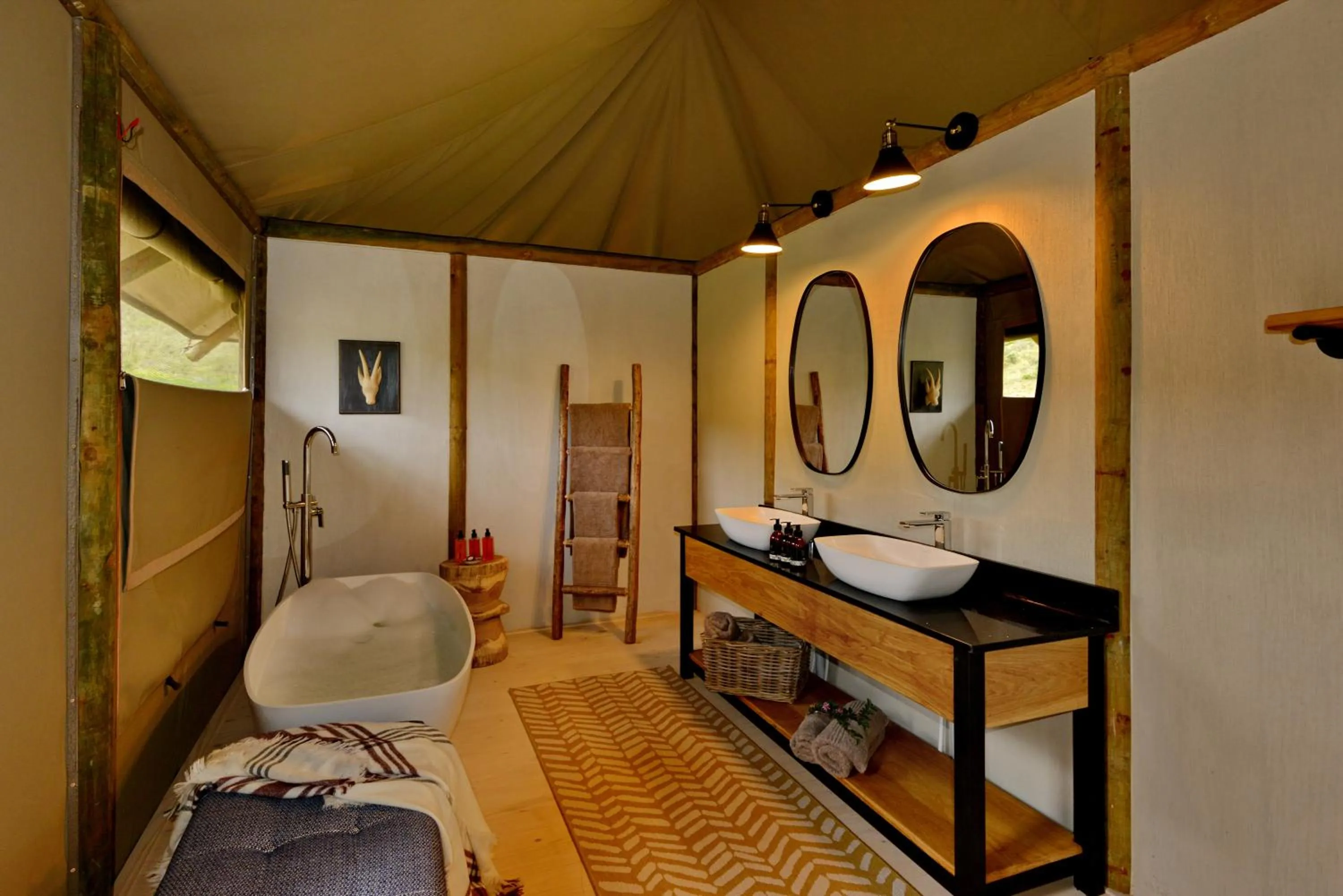 Bed in Garden Route Safari Camp