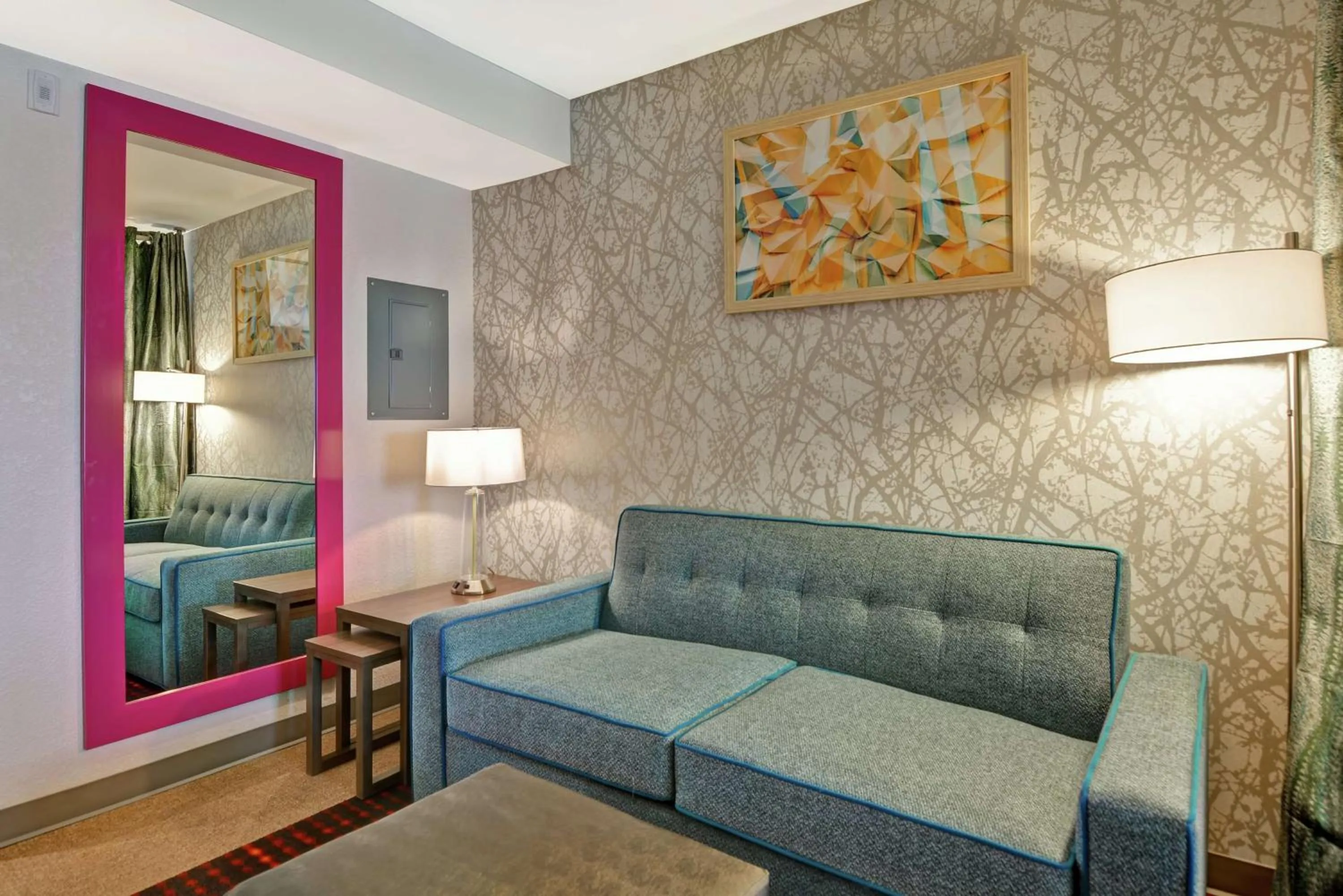 Living room, Bed in Home2 Suites By Hilton Beaufort