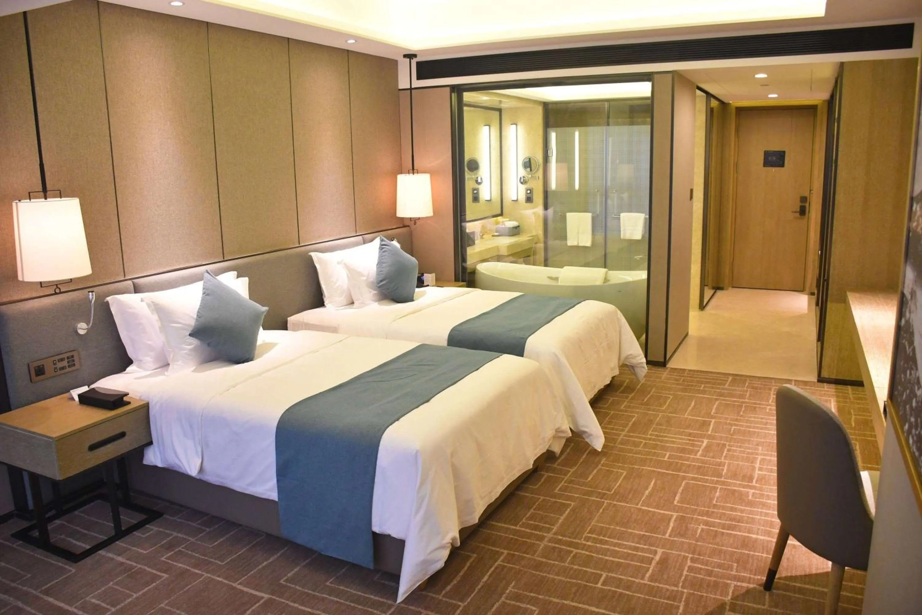 Photo of the whole room, Bed in Wyndham Grand Maoming