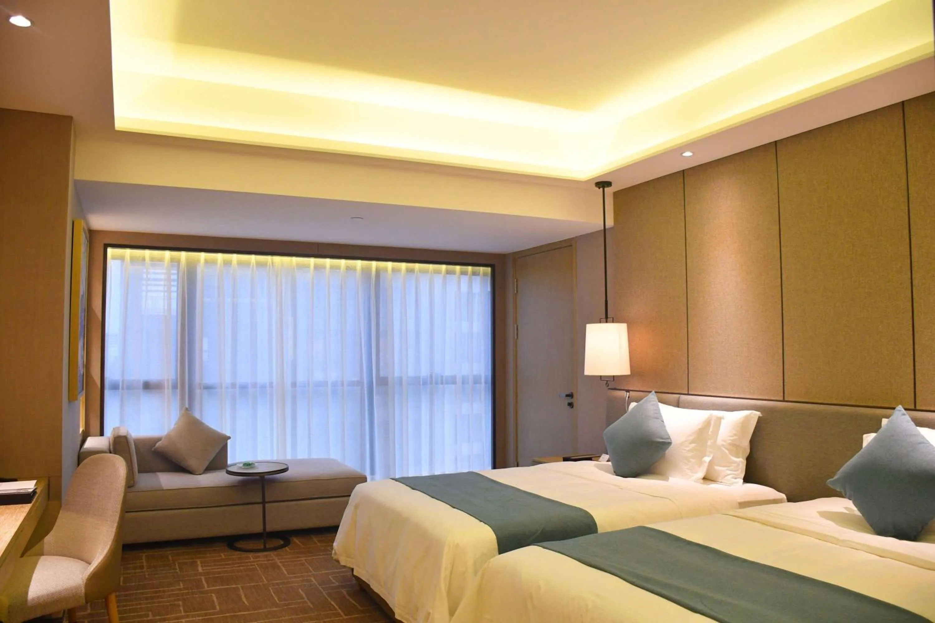 Photo of the whole room, Bed in Wyndham Grand Maoming