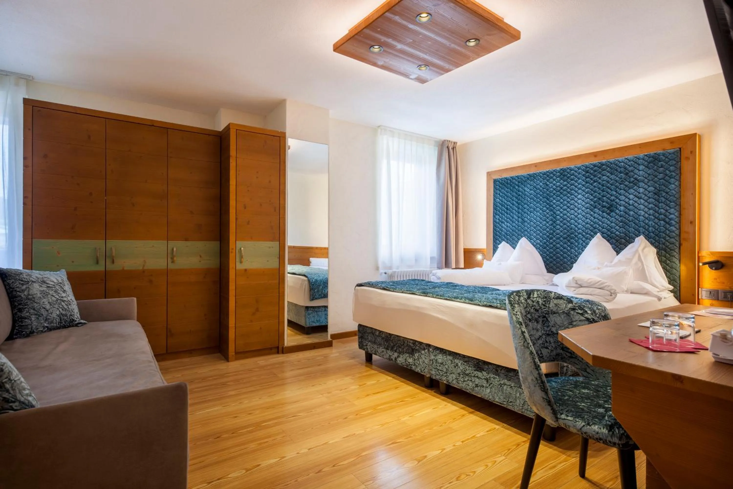 Bed in ADLER MERYEM wellness hotel - Andalo