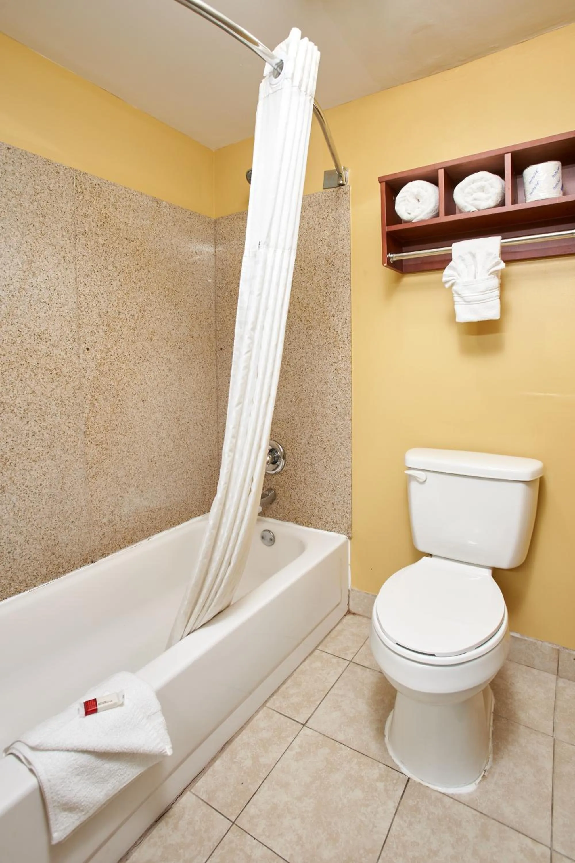 Toilet in Super 8 by Wyndham Wichita Airport West Kellogg