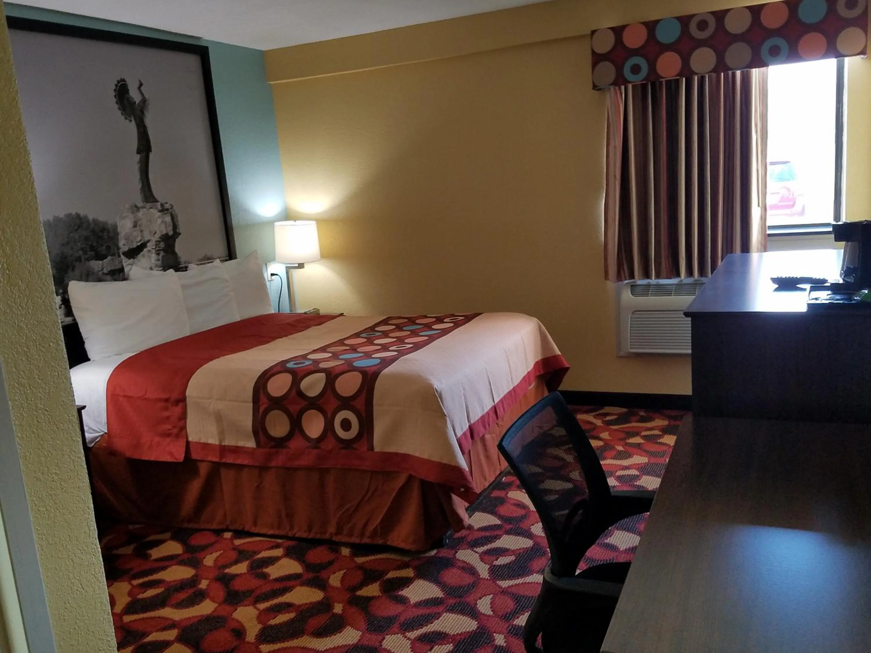 Decorative detail, Bed in Super 8 by Wyndham Wichita Airport West Kellogg