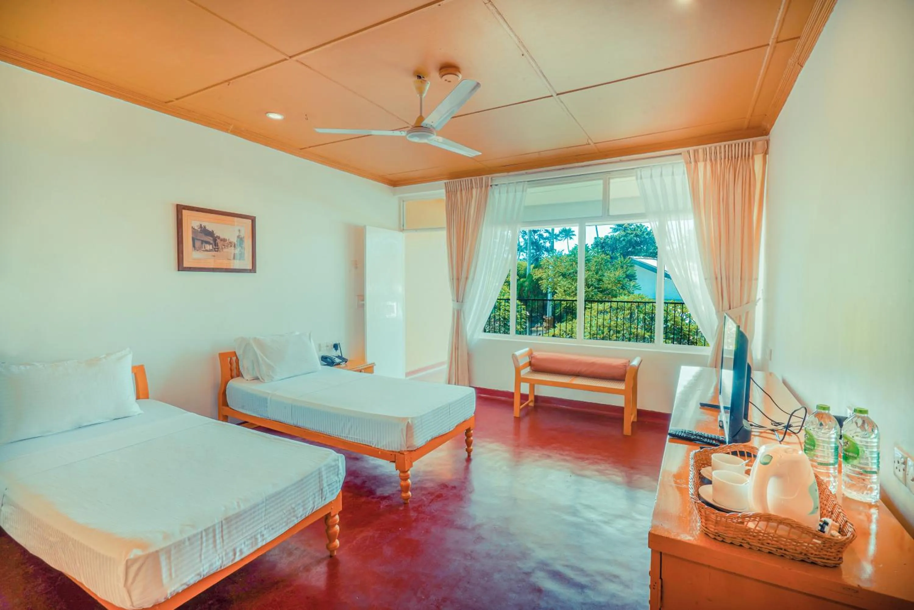 Bed in Reef Garden Hotel