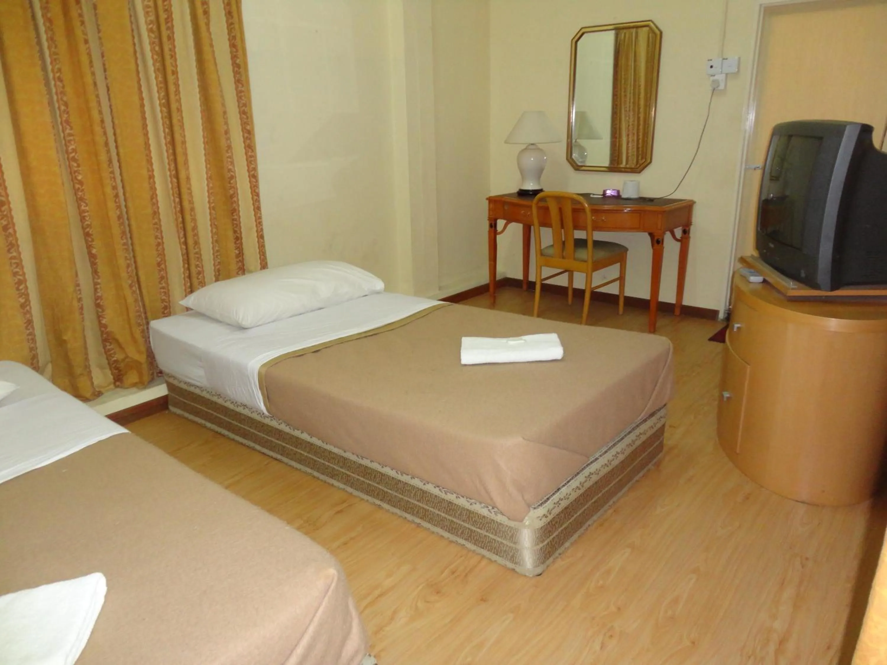 Bed in Pristine Hotel
