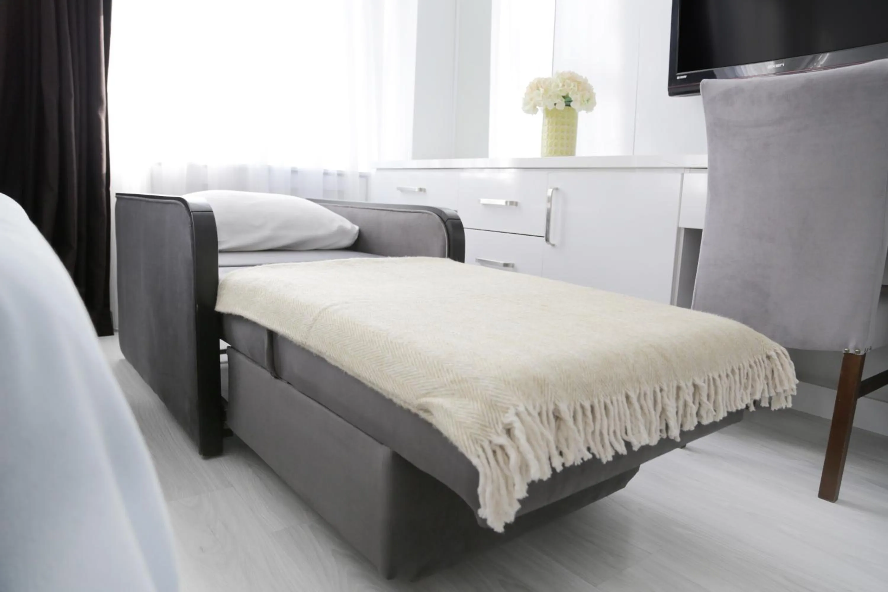 Seating area, Bed in Bayer Hotel