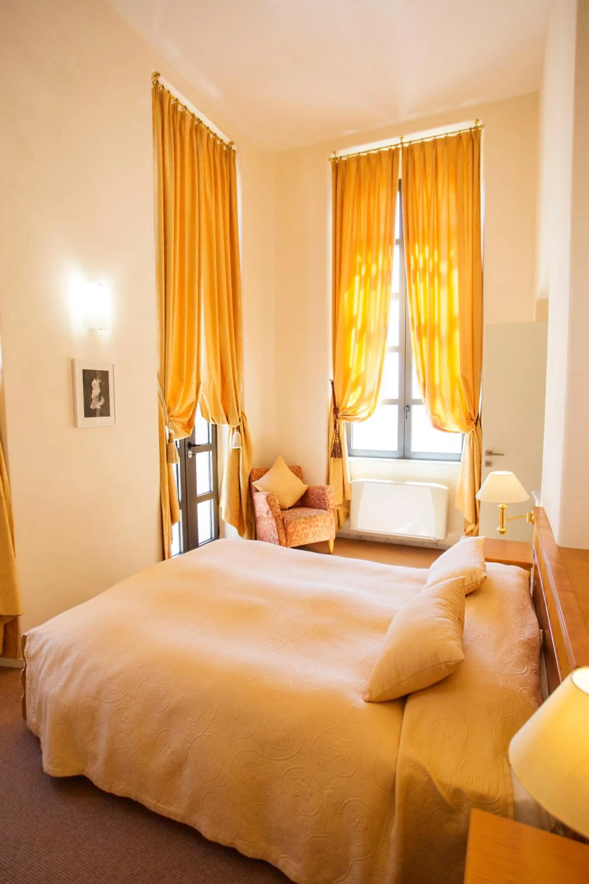 Bed in Miramare Apartments&Suites