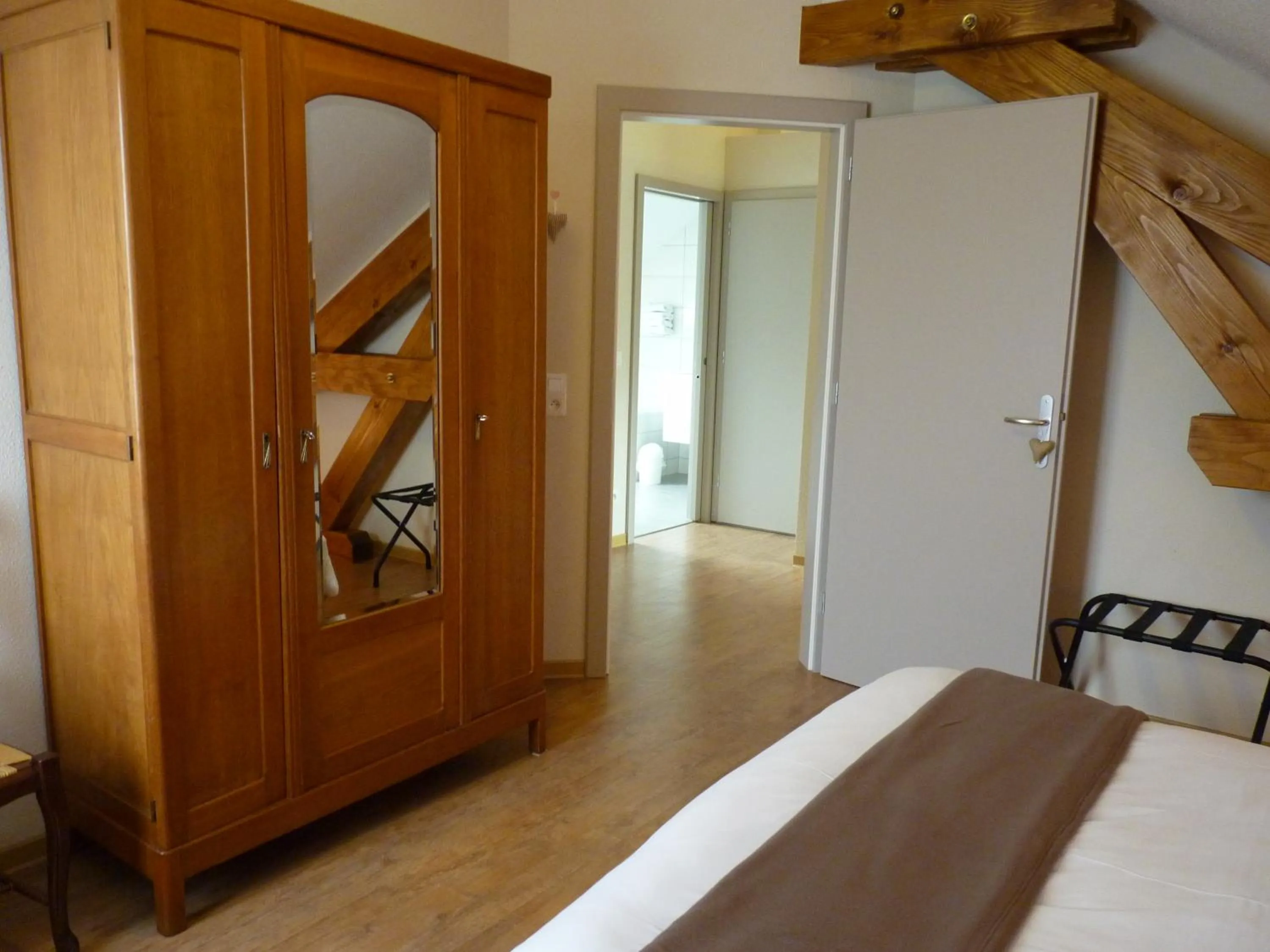 Decorative detail, Bed in Logis Hôtel Notre-Dame - restaurant ouvert midi et soir sauf dimanche soir