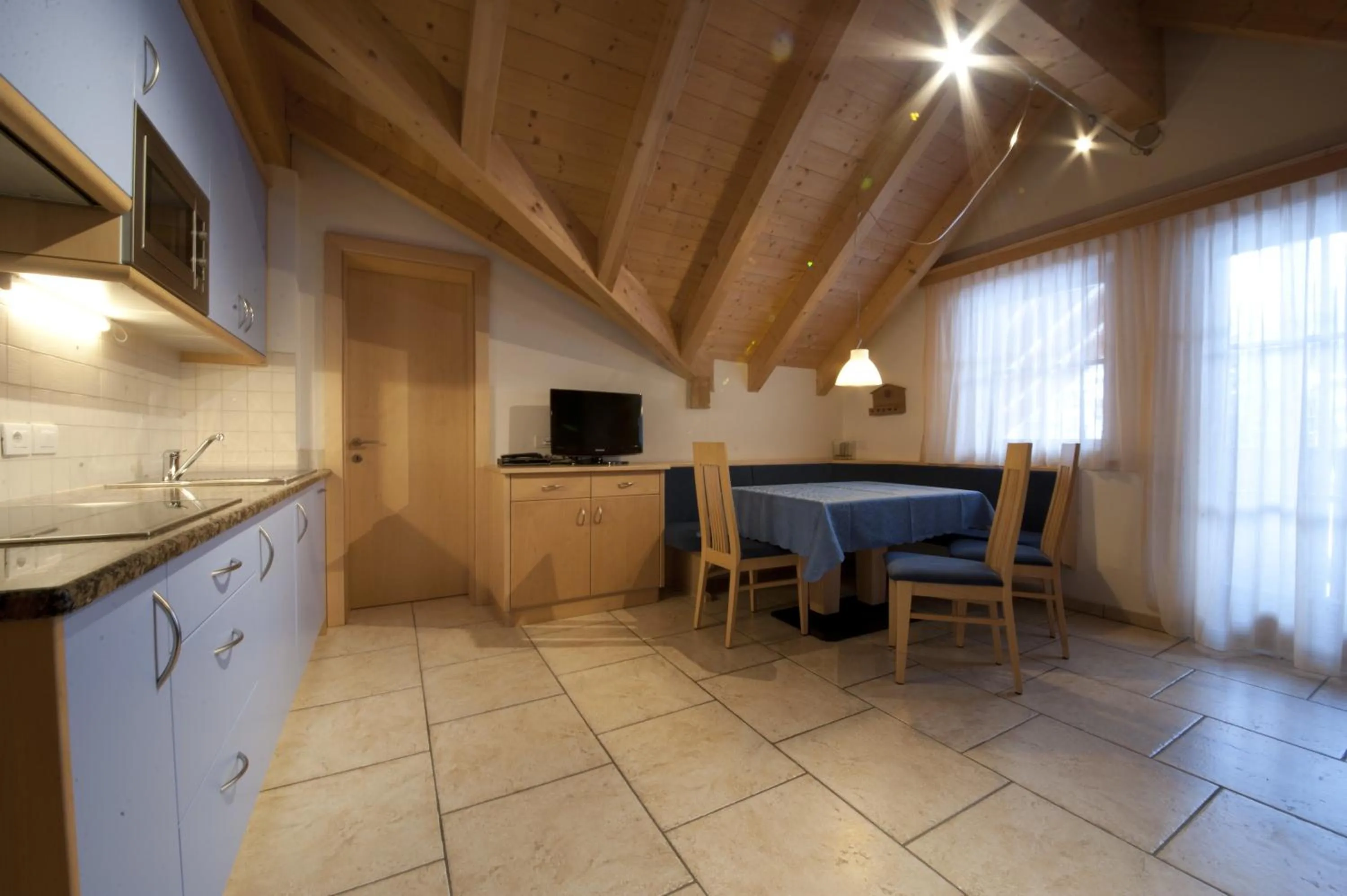 Kitchen or kitchenette in Appartamenti Villa Olympia