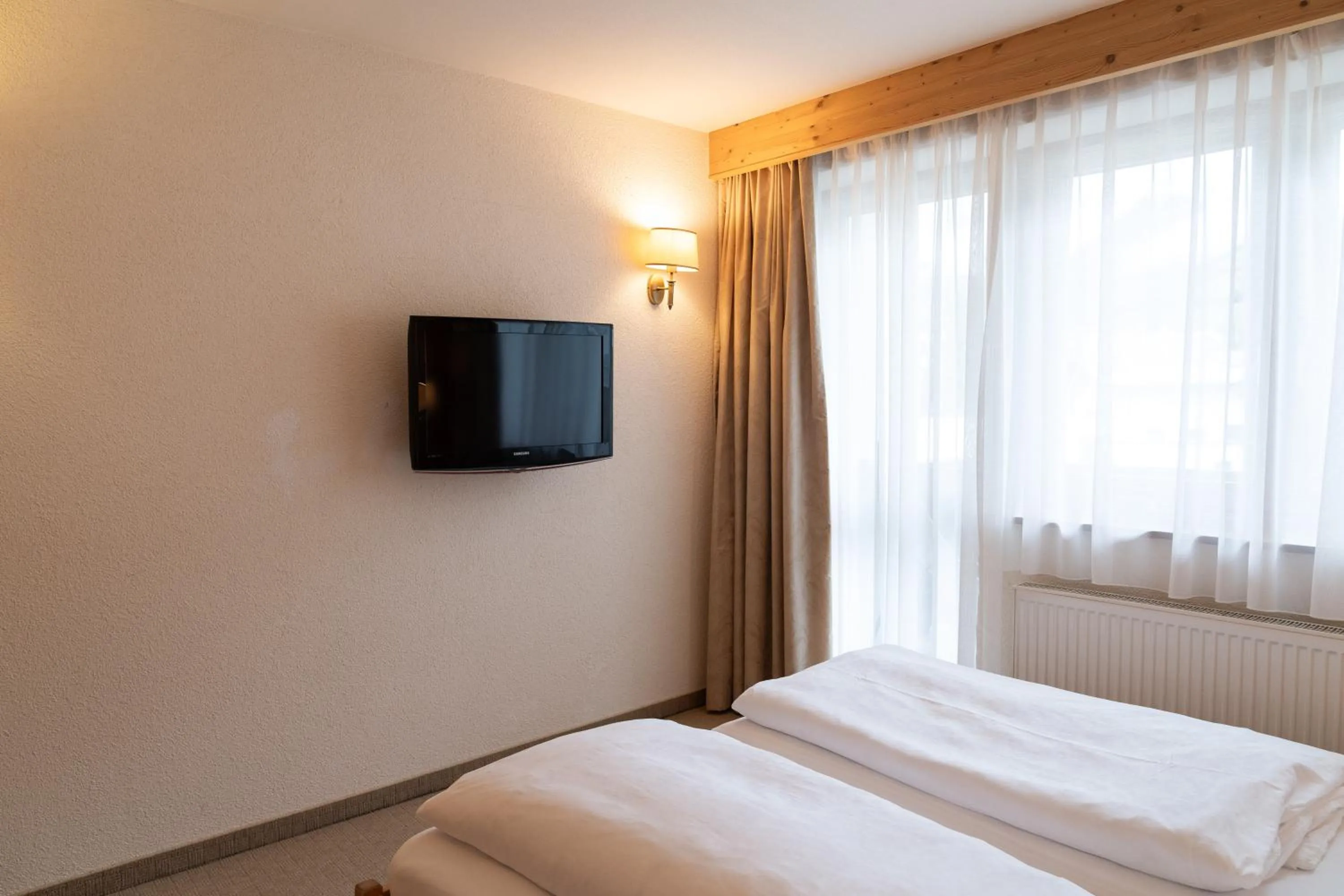 Communal lounge/ TV room, Bed in Wellnesshotel Mein Almhof Superior