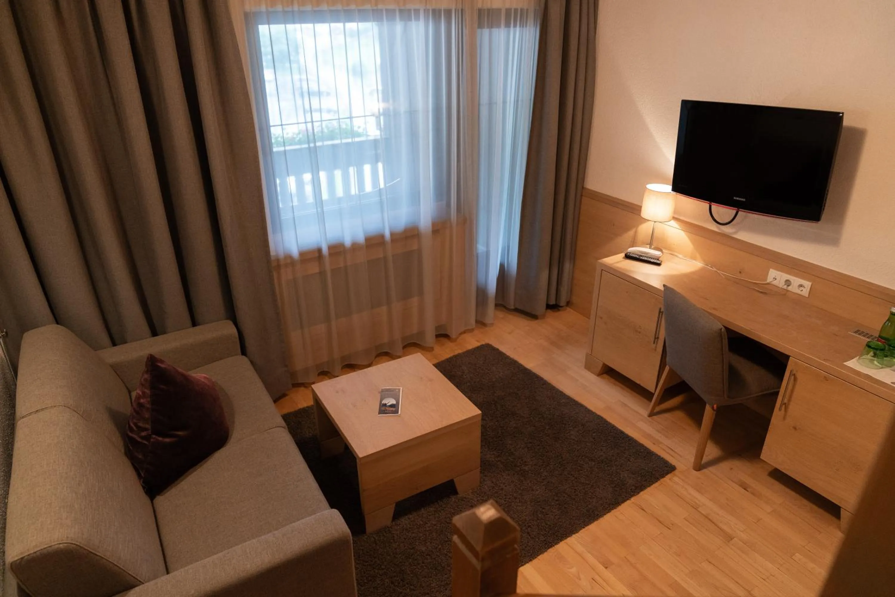 Communal lounge/ TV room in Wellnesshotel Mein Almhof Superior