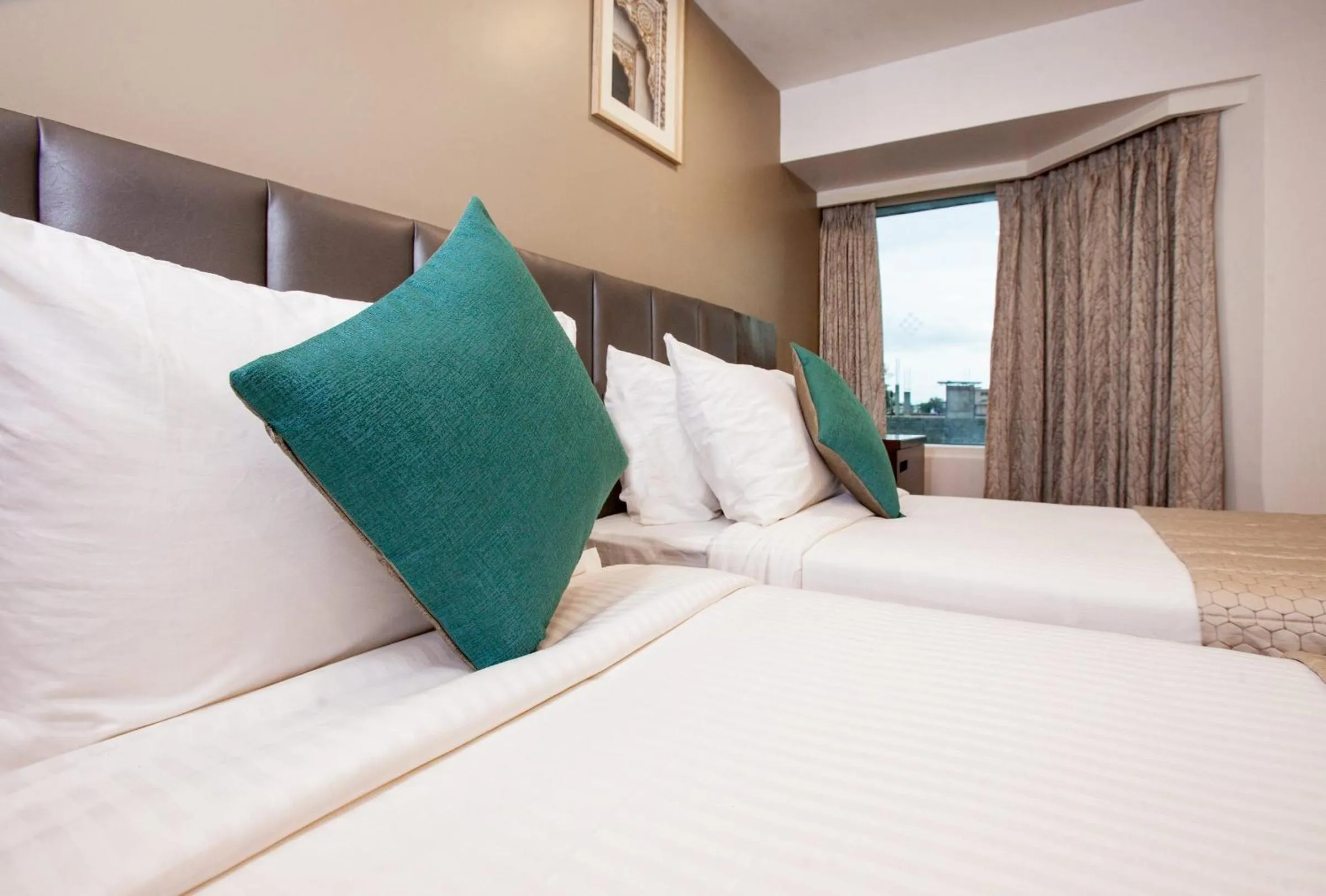 Bed in Mango Suites Viera