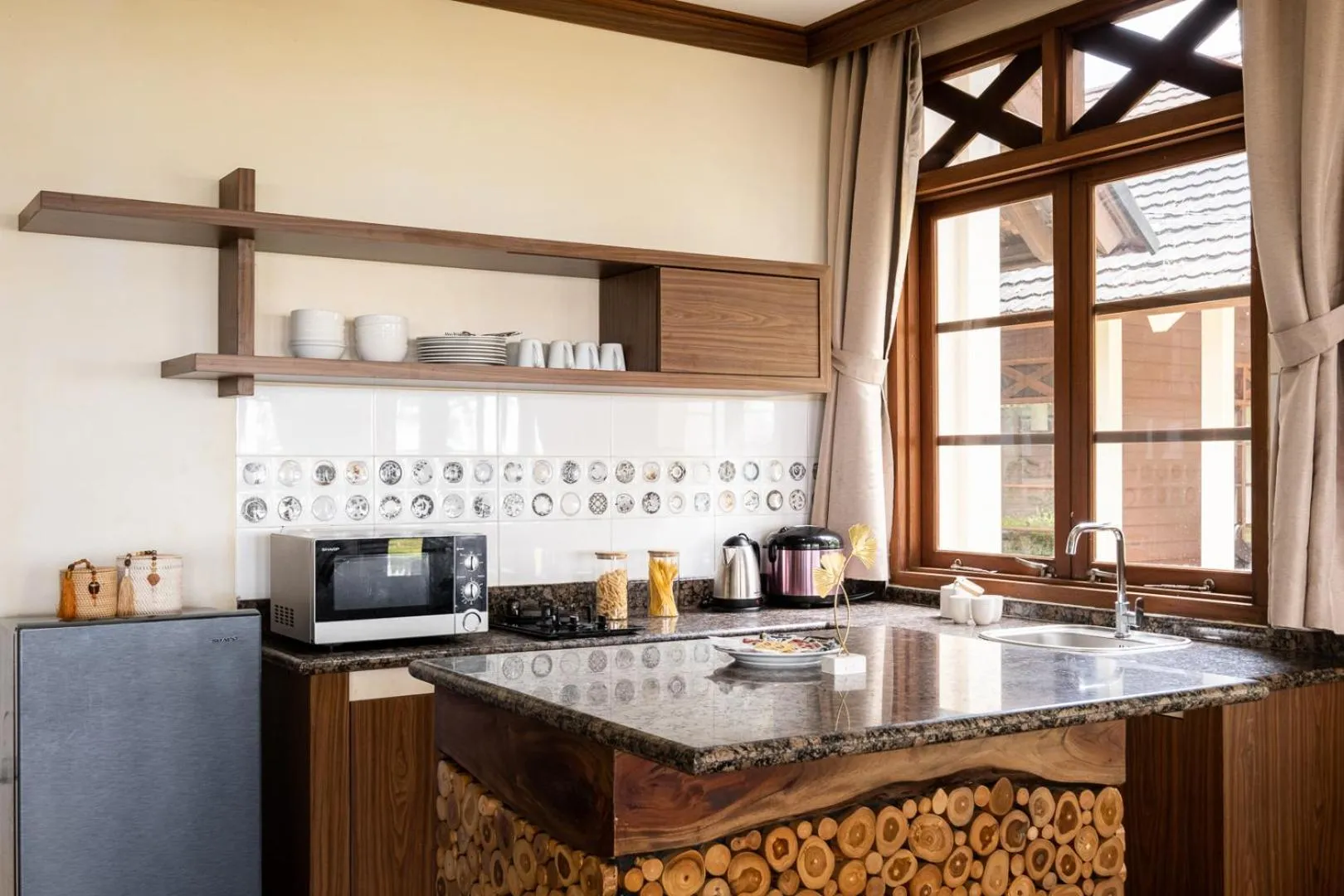 Kitchen or kitchenette in Mutiara Carita Cottages