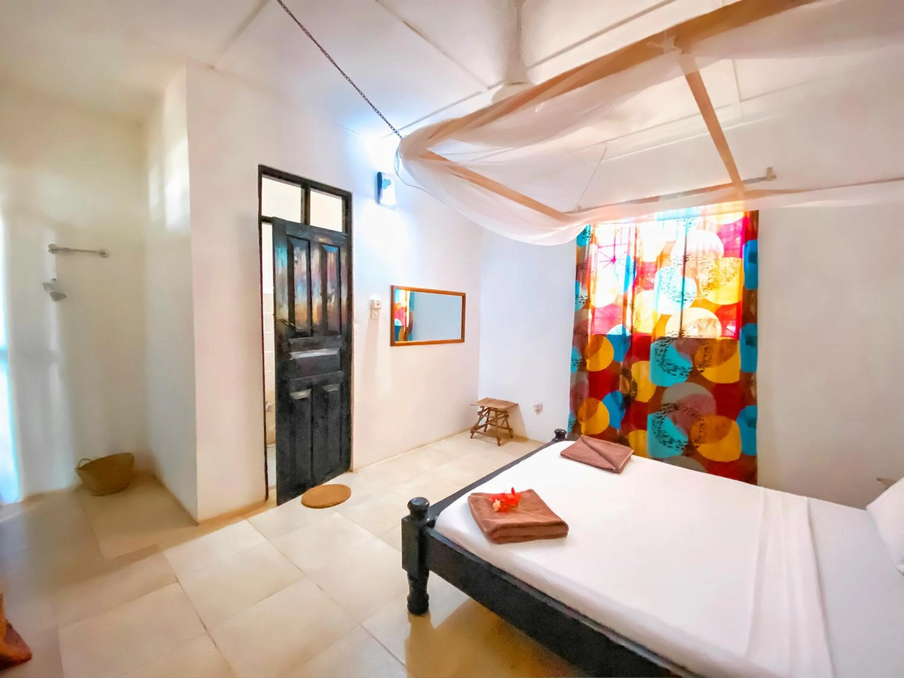 Photo of the whole room, Bed in Papaya Guest House Nungwi